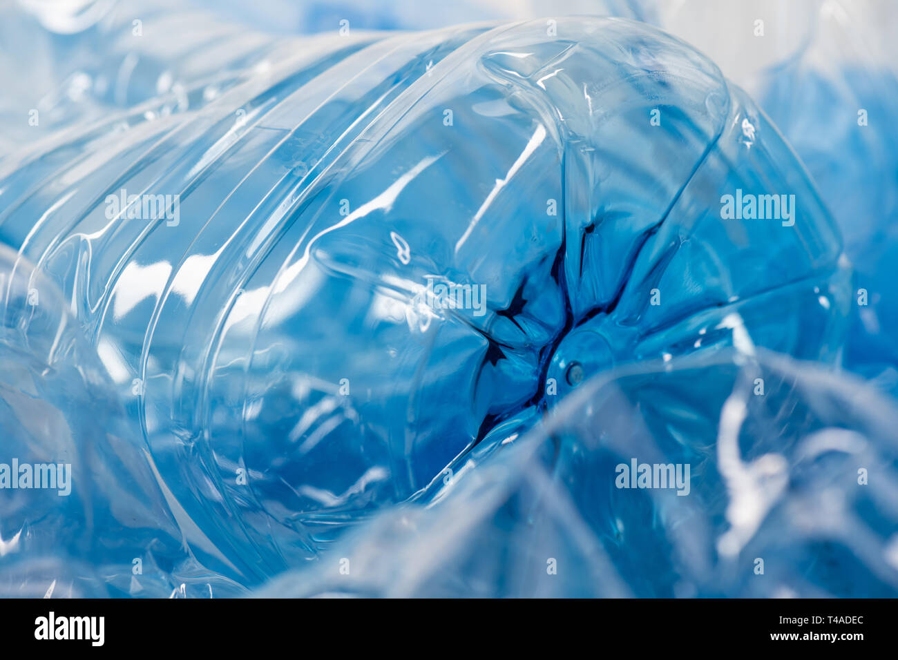 Clear transparent blue plastic containers being issue for nature and environment Stock Photo