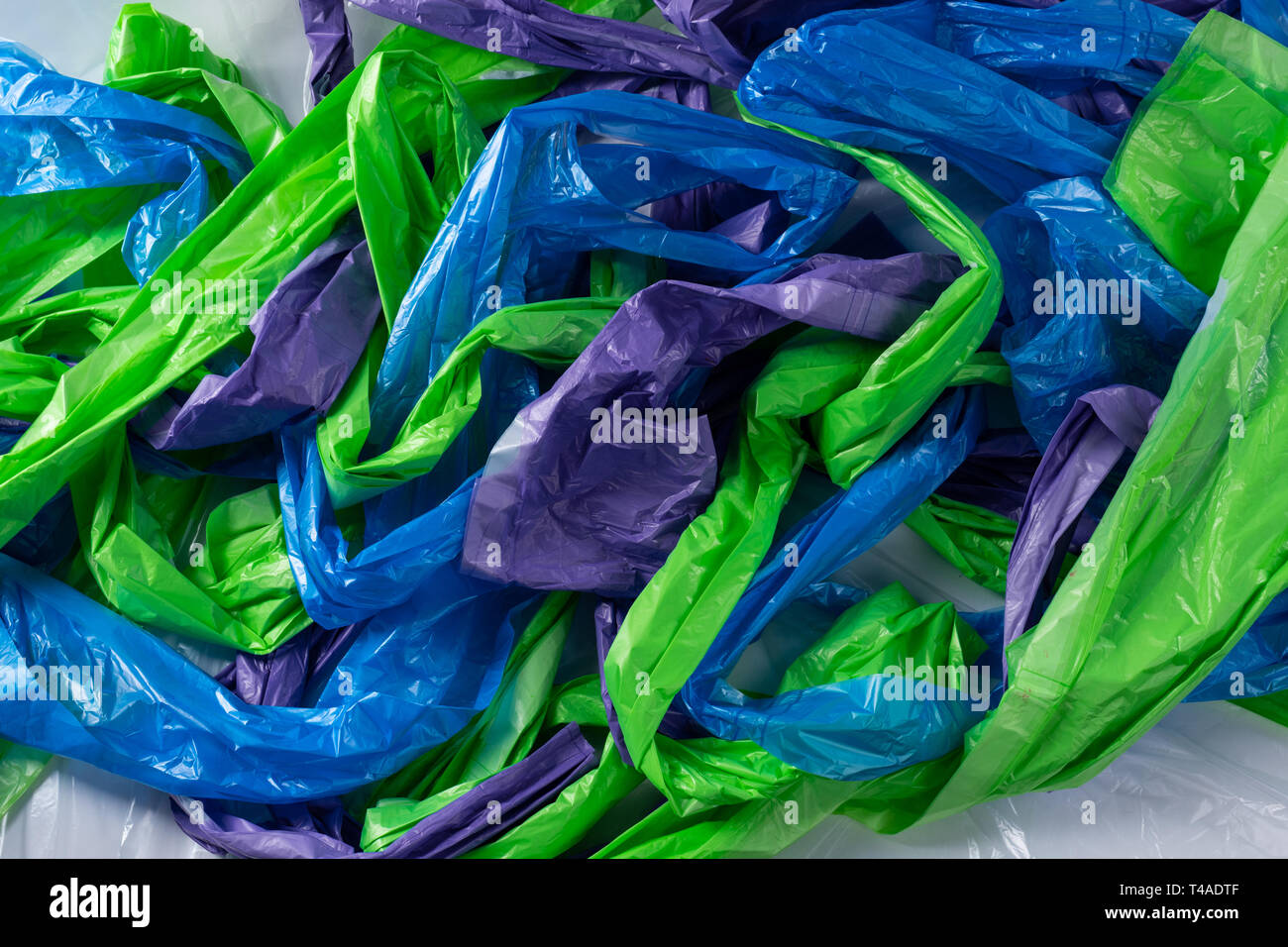 Scaring amount of colorful plastic trash bags Stock Photo