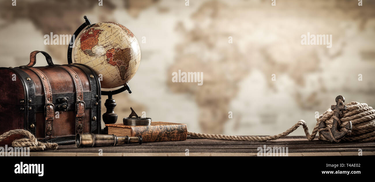 Vintage World Globe, Old Fashioned Suitcase, Compass, Telescope, Book, Rope, And Anchor With Map Background And Grunge Effect.  - Travel Concept Stock Photo