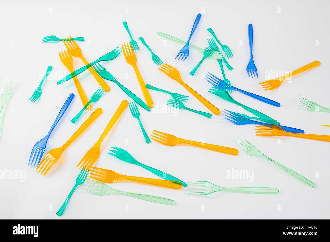 Clear plastic forks made of transparent cheap plastic being thrown