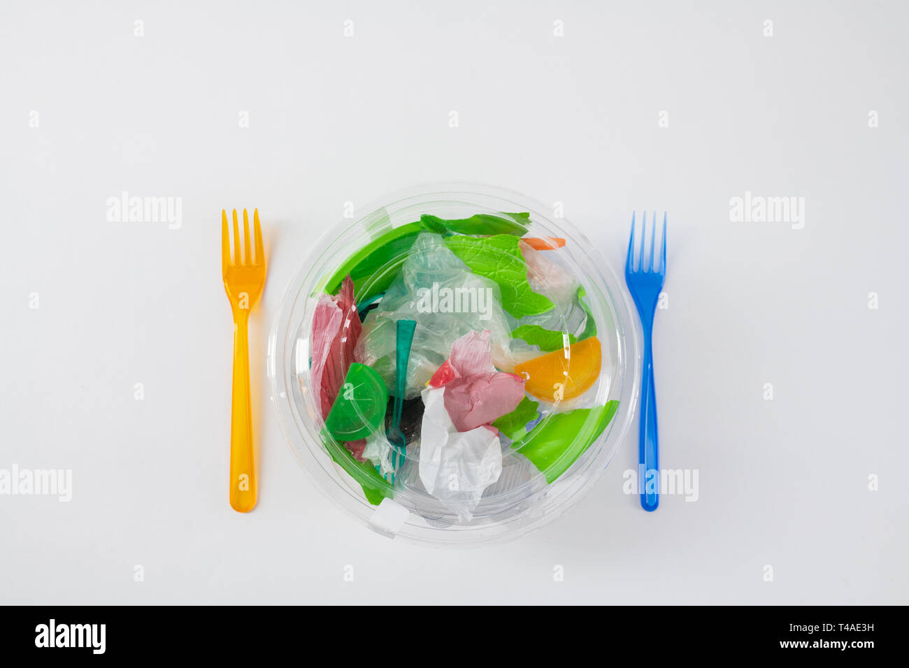 Transparent package with trash and plastic bags inside Stock Photo