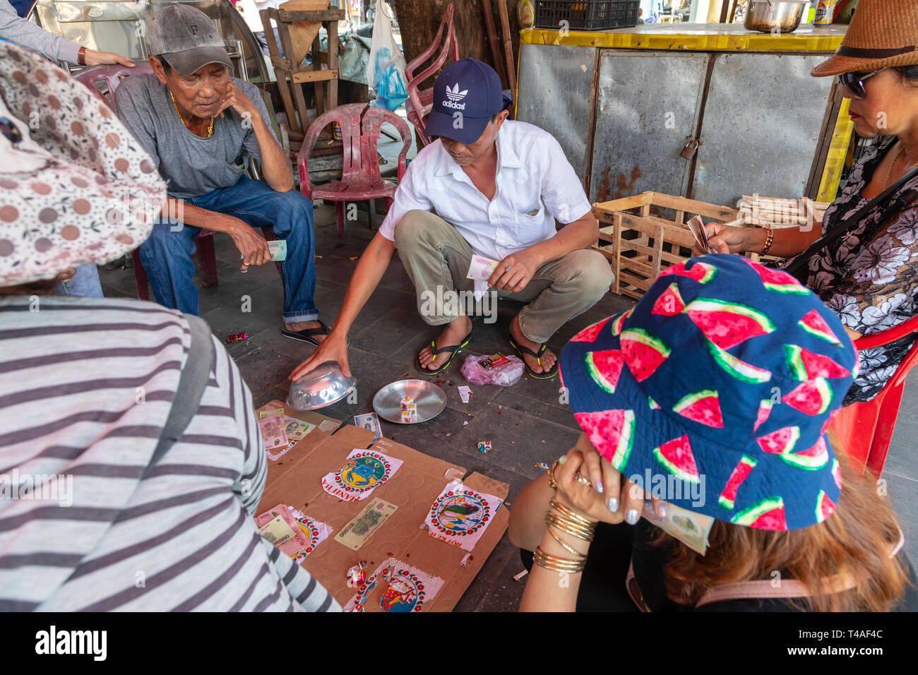 Street gambling den playing dice based betting and a homemade board, back streets, Old quarter, Hoi An, Quang NAm Provence, Vietnam, Asia Stock Photo