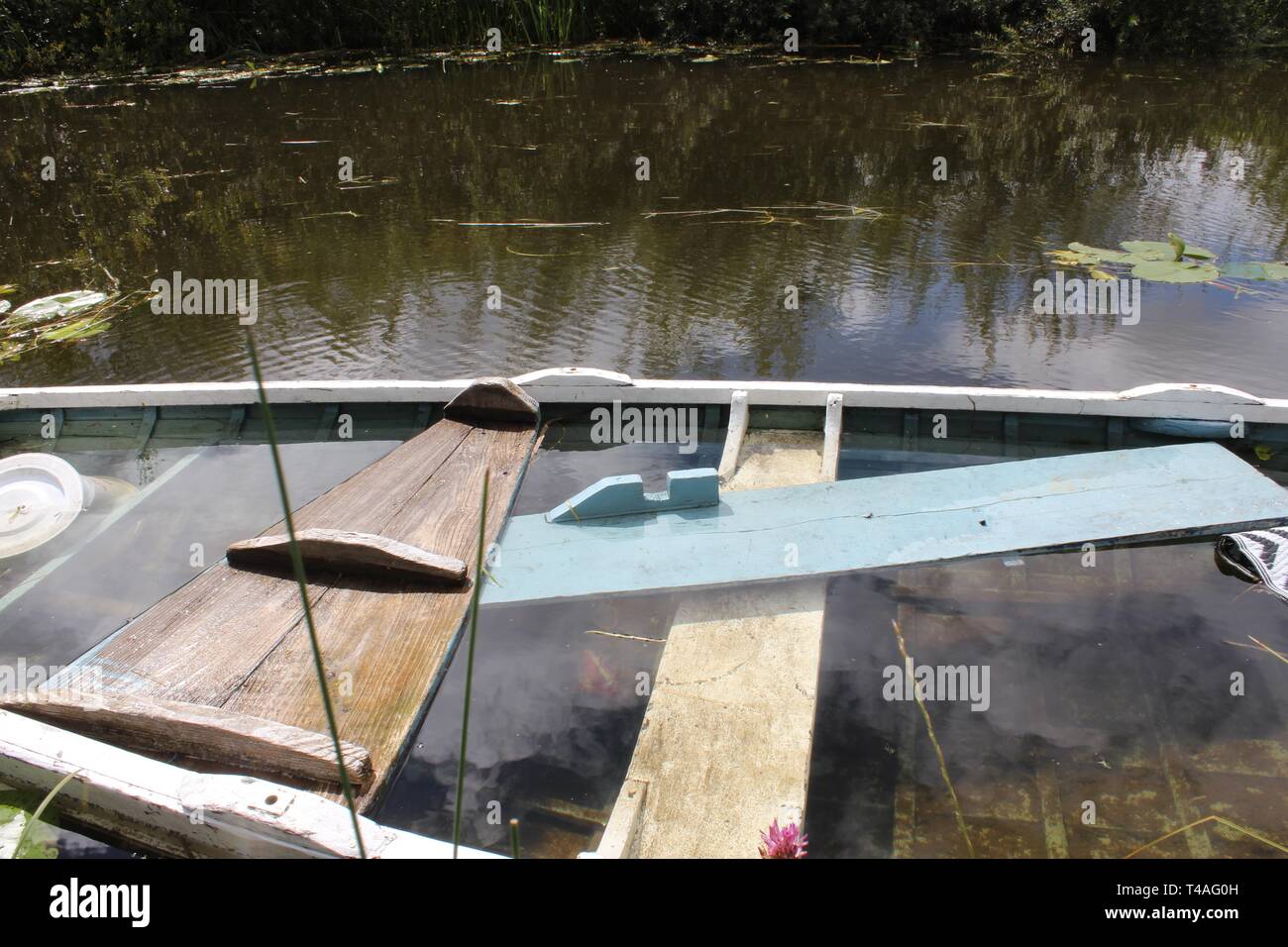 Derelict Canal Litter Sunken boat Stock Photo