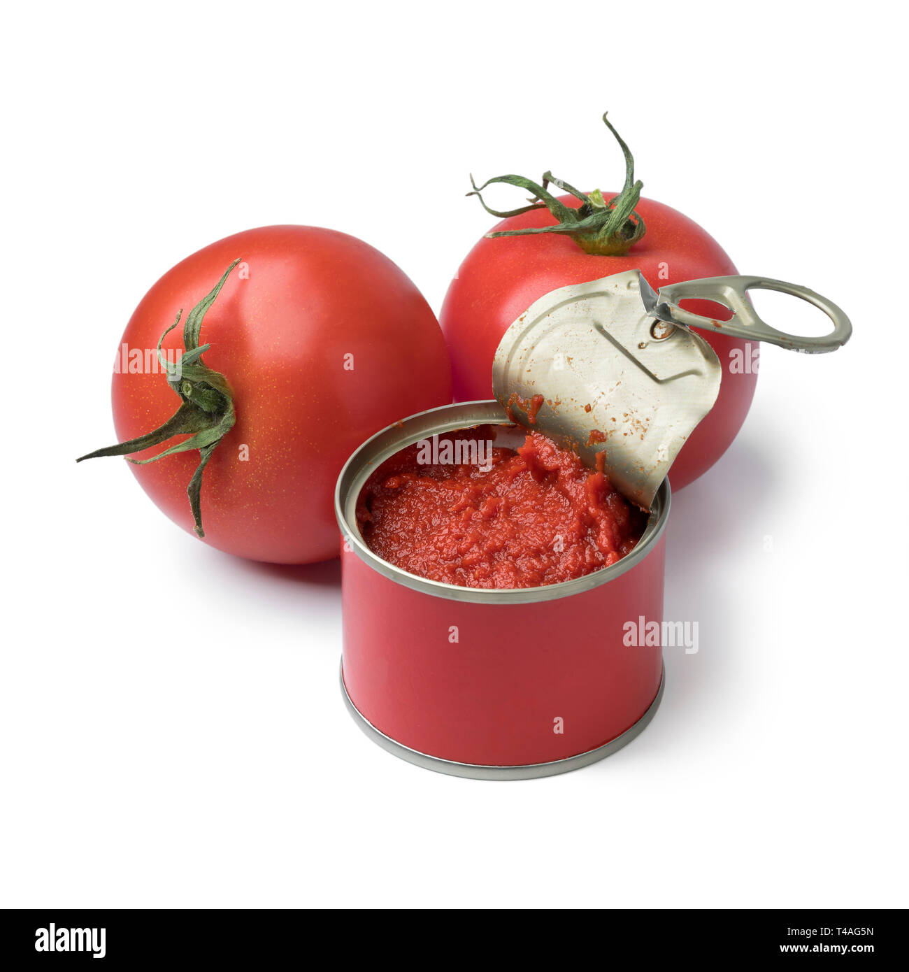 Open can with tomato paste and fresh tomatoes isolated on white background Stock Photo