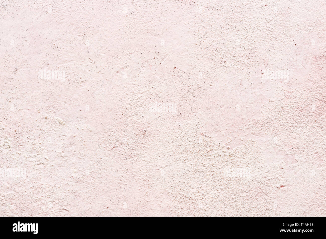 Light pink texture of plaster or stucco wall, close-up. Gentle