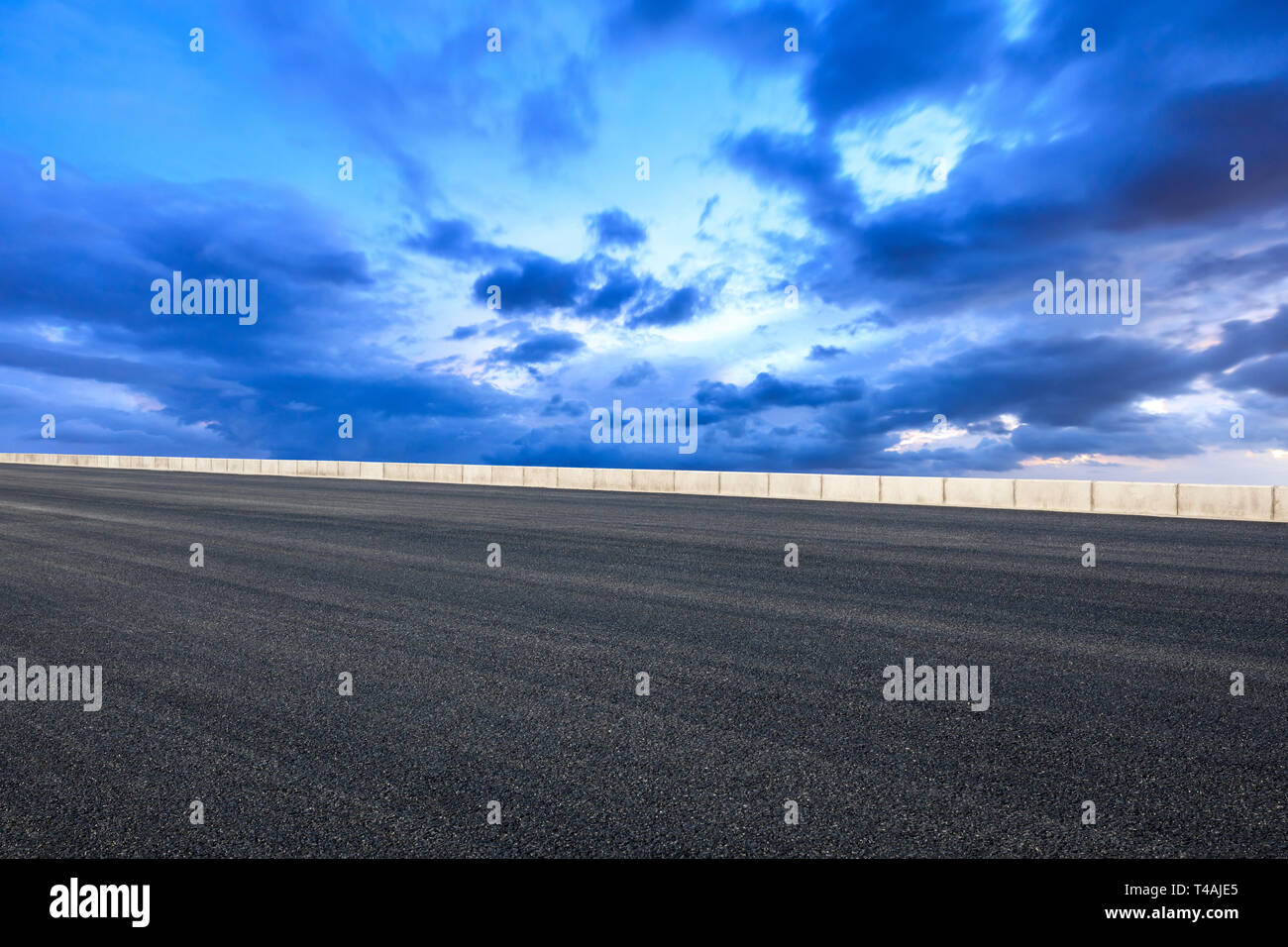 Empty asphalt road and beautiful sky clouds at sunset Stock Photo - Alamy