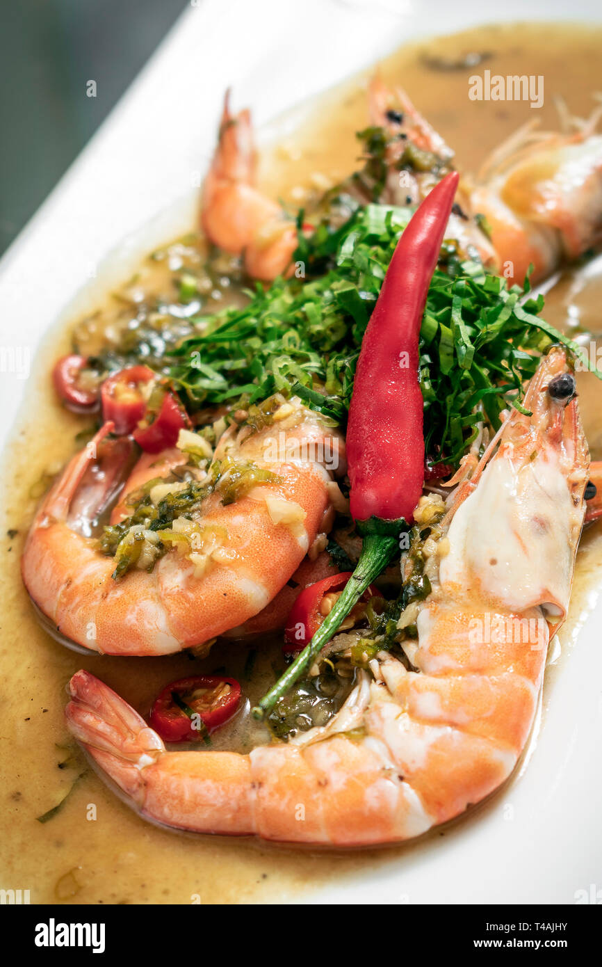 spicy asian prawns in gourmet chilli orange and coriander sauce in