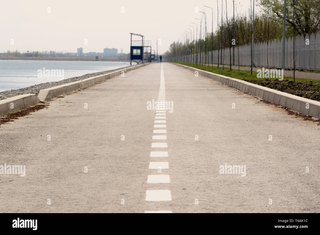 highway with a dividing strip goes into the distance Stock Photo