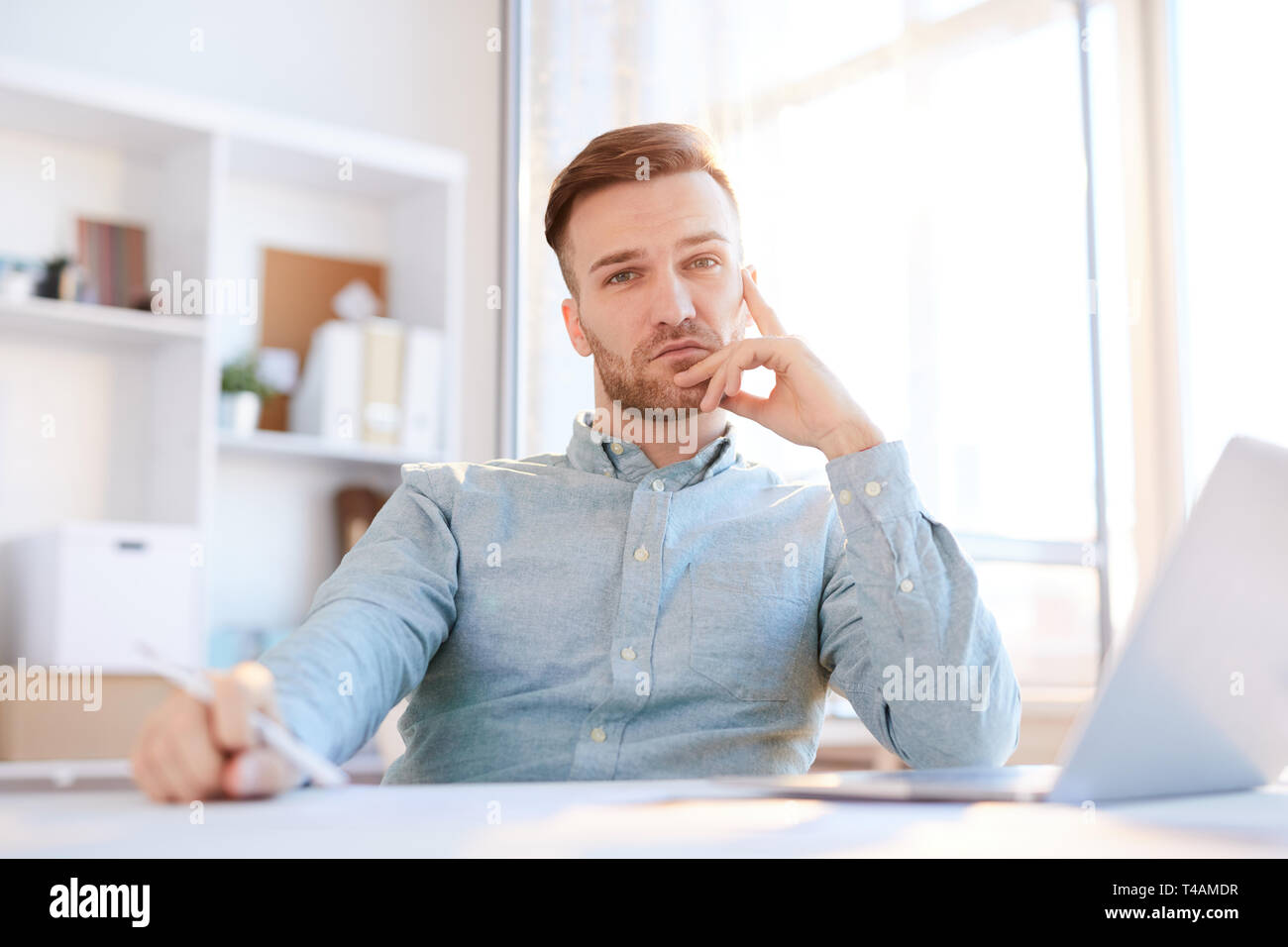 Handsome Businessman Posing in Sunlight Stock Photo