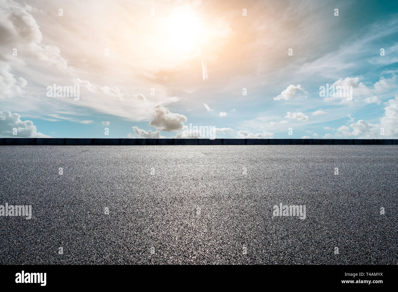 Empty asphalt road and beautiful sky clouds at sunset Stock Photo - Alamy