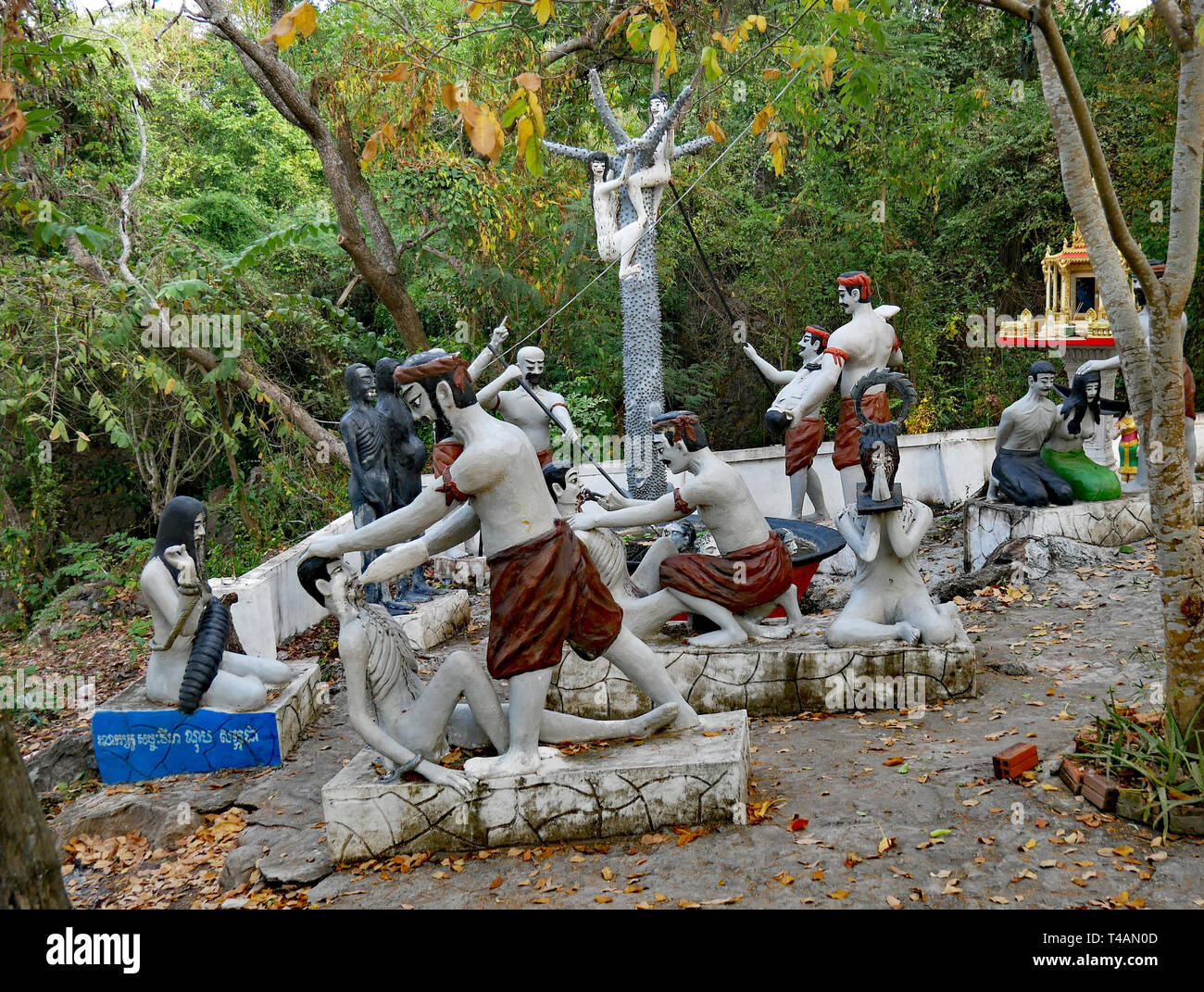 A scene of horror depicting Naraka, Buddhist Hell. Male and female sculptures in a tableau of agony, torture and torment. Cambodia 07-12-2018. Stock Photo