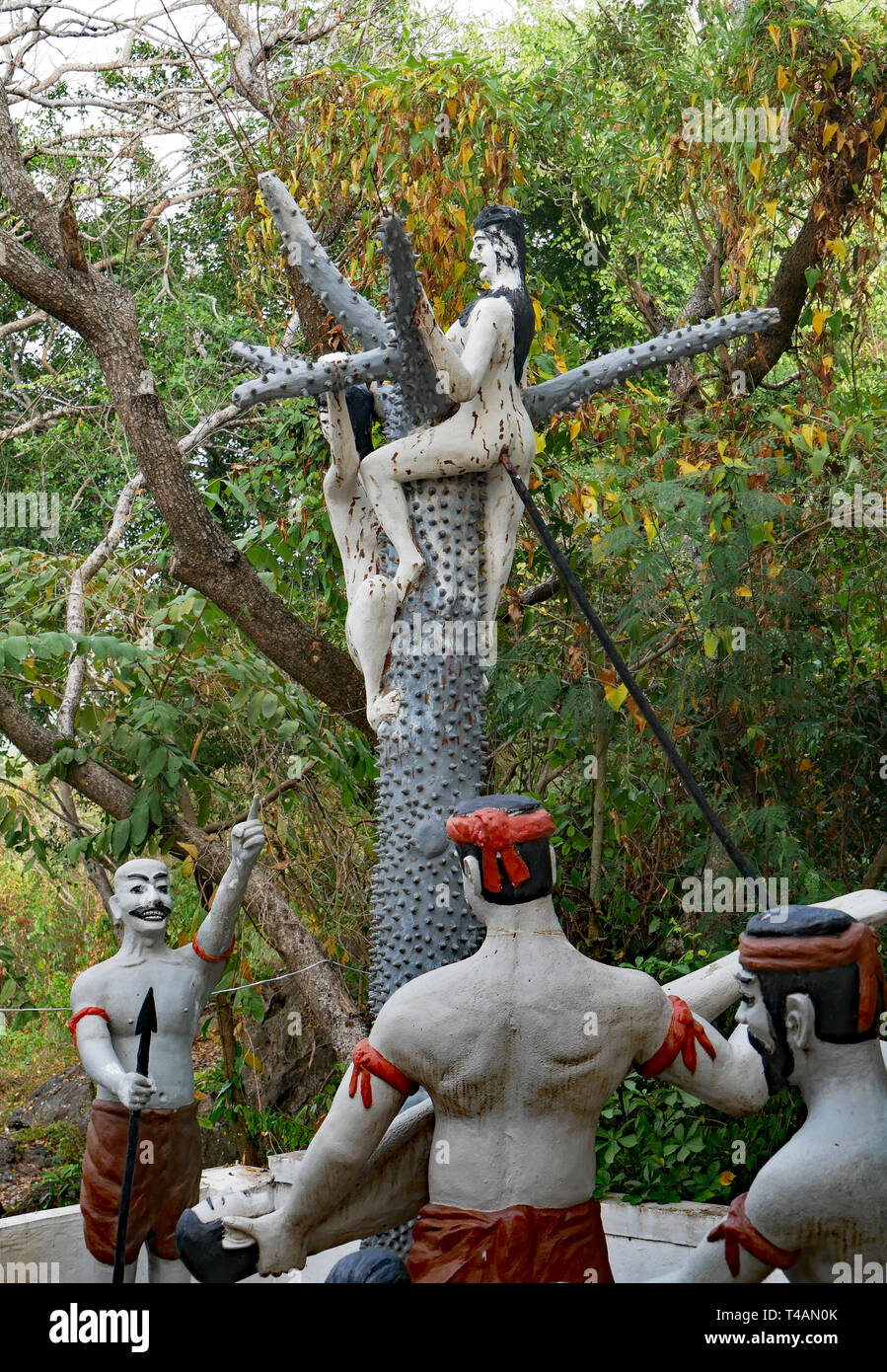 A tableau of torture and torment depicts what sinners can expect when sent to Buddhist Hell, Naraka. Near the Killing Caves, Cambodia 07-12-2018. Stock Photo