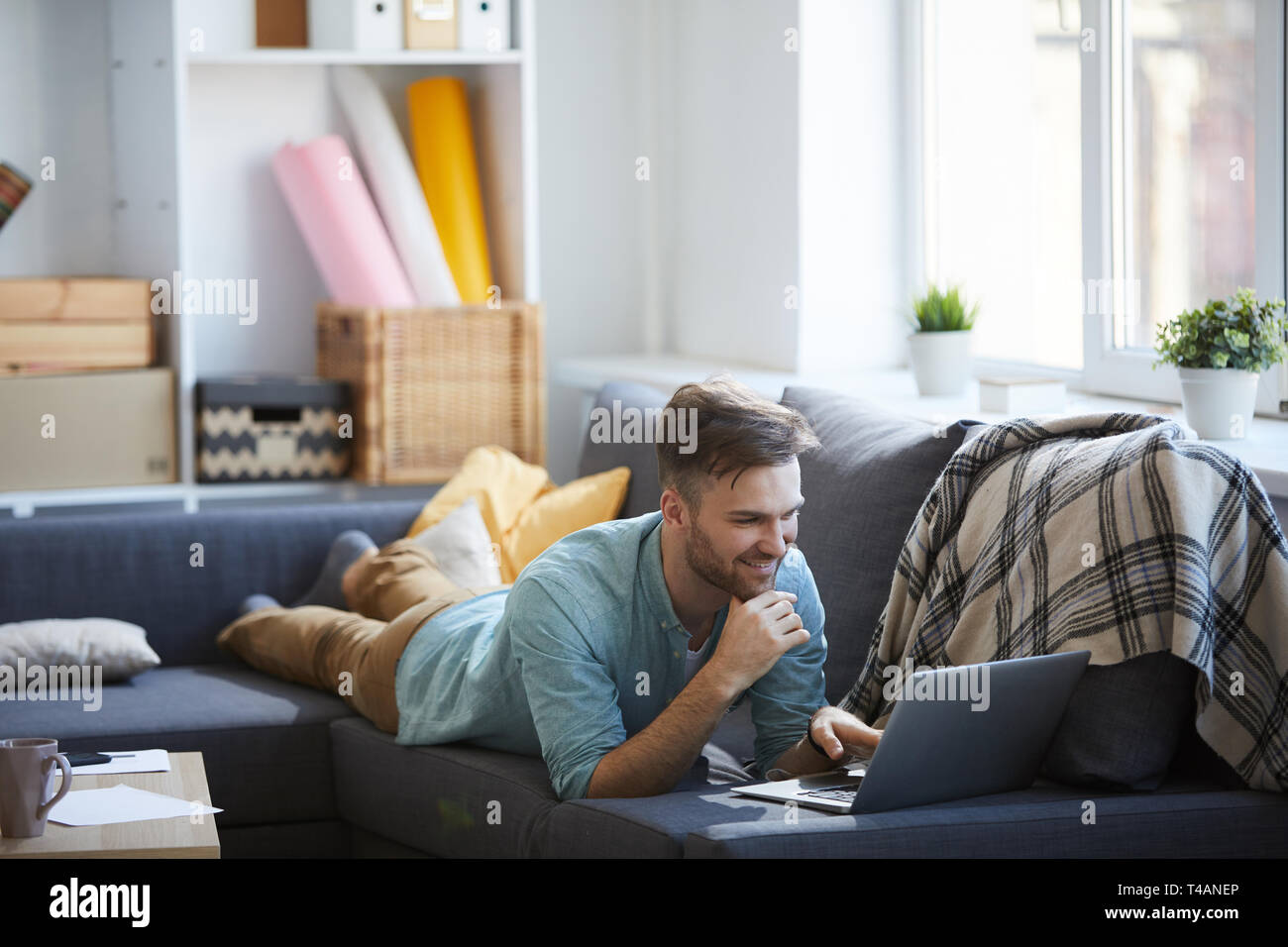 Young Man Relaxing at Home Stock Photo