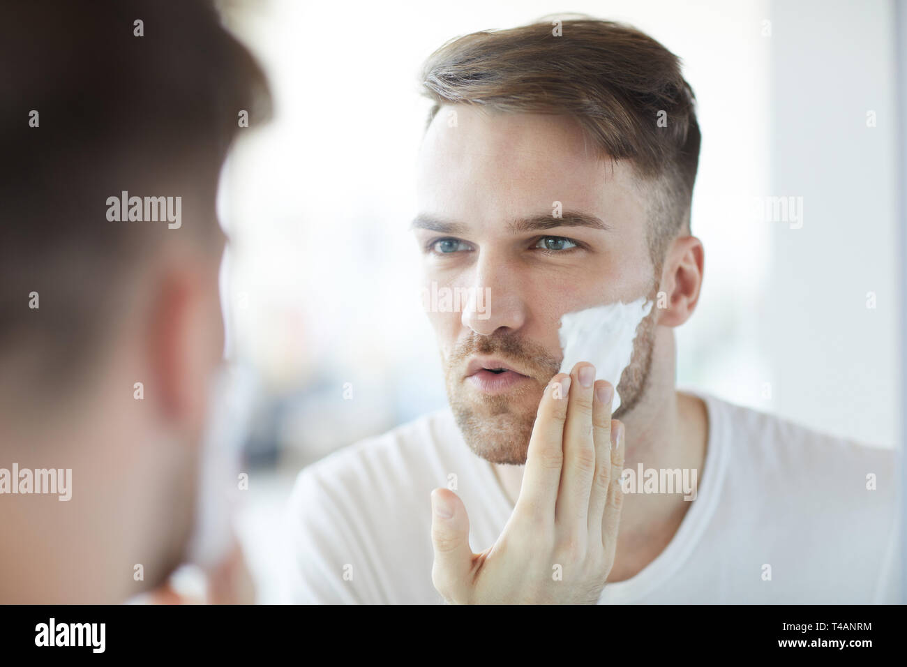 Handsome Man Shaving Stock Photo