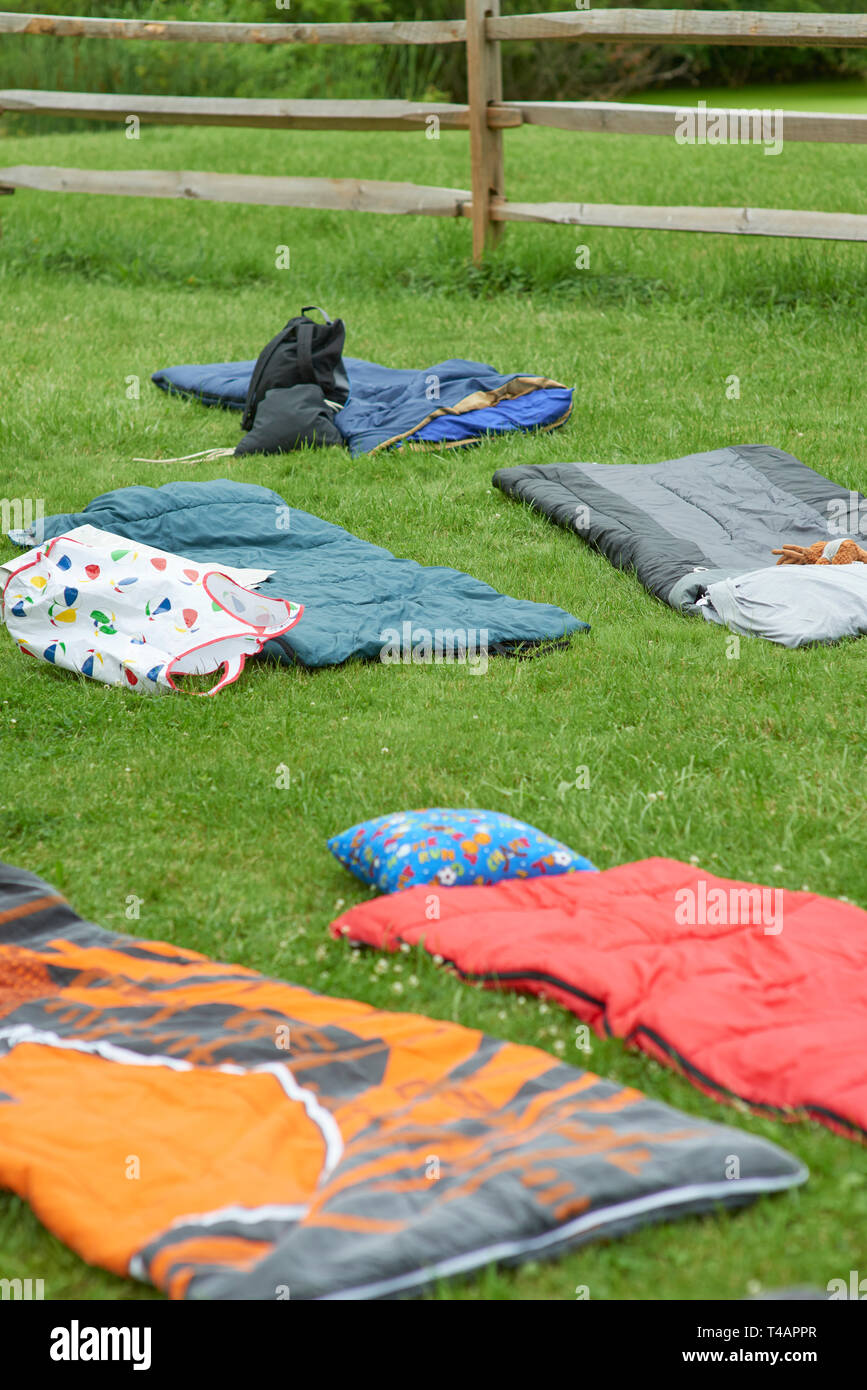 camper sleeping bags in meadows Stock Photo