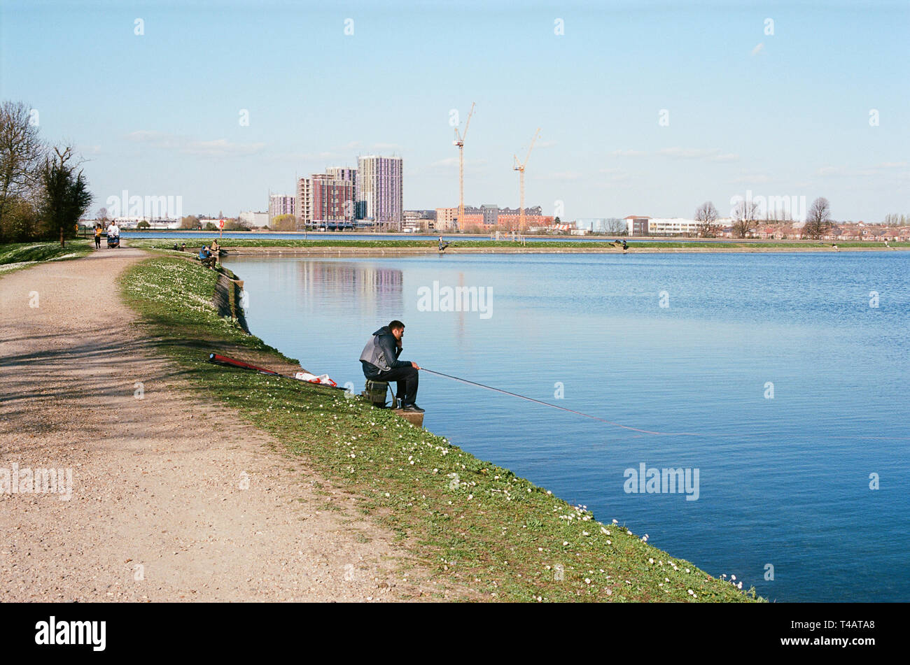 Anglers on the banks of Walthamstow Reservoirs on Walthamstow Wetlands, North East London UK Stock Photo