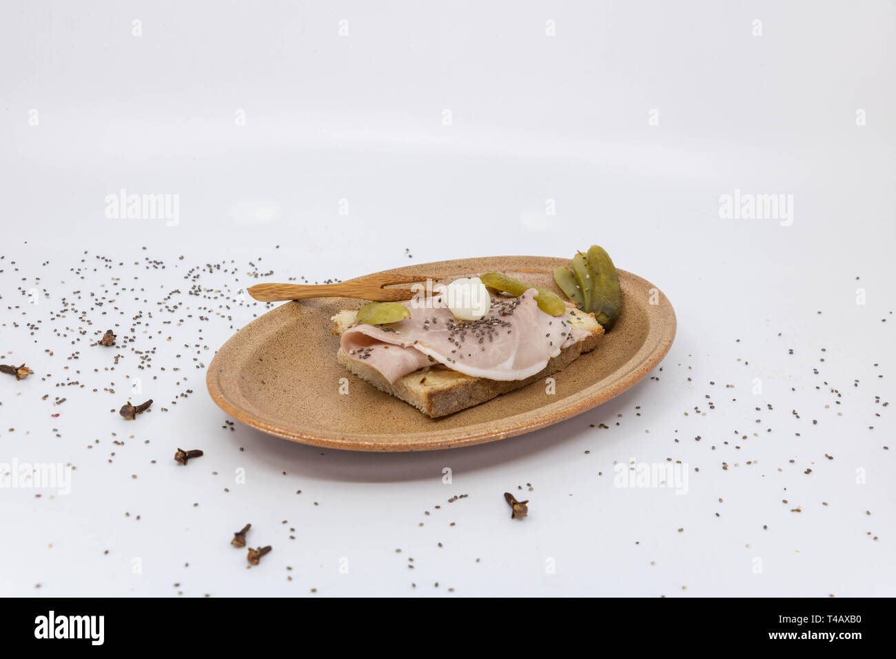 Ham ham sandwich with gherkin served in a Vallauris ceramic plate Stock