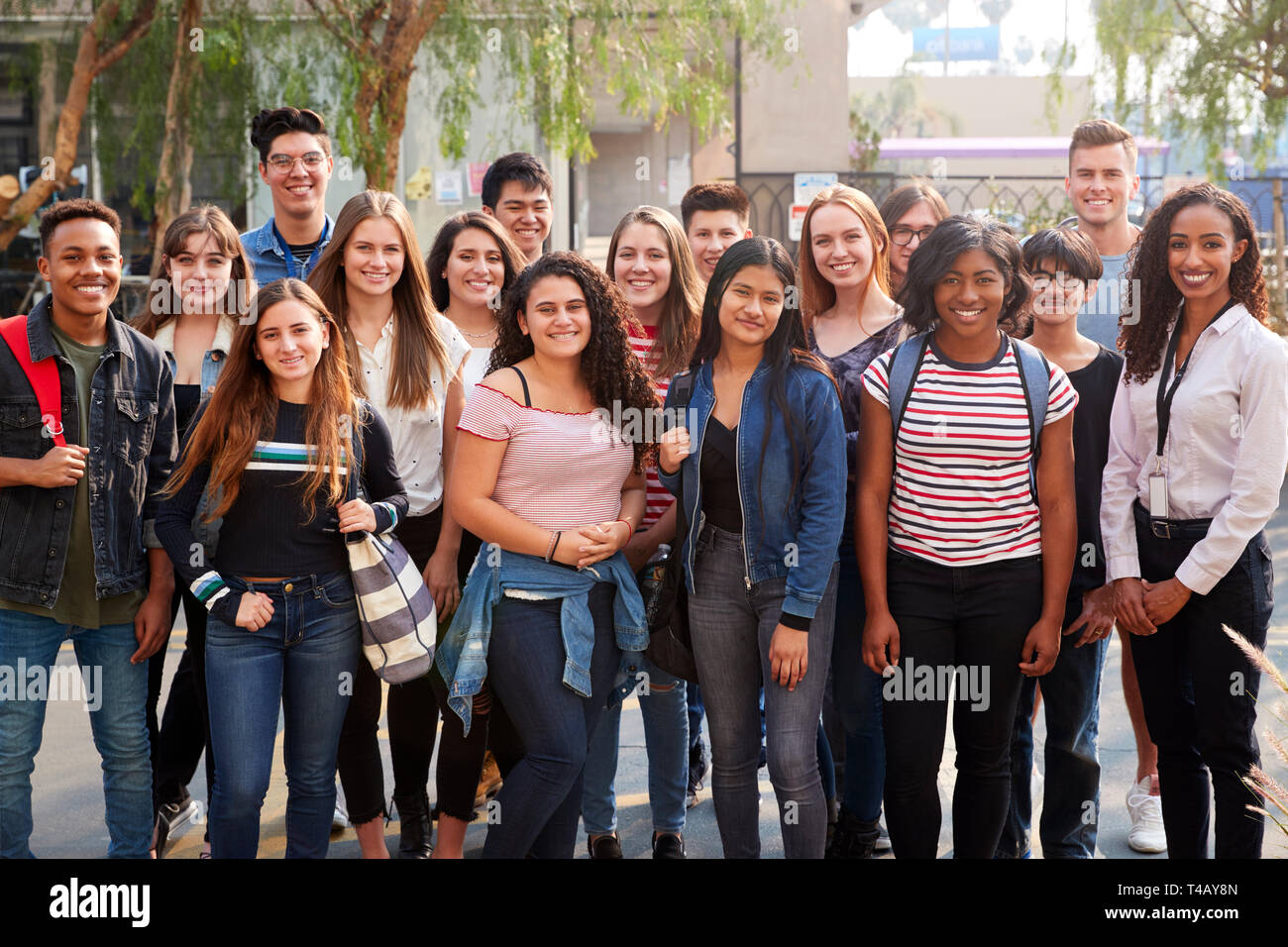 Portrait Of Smiling Male And Female College Students With Teachers ...