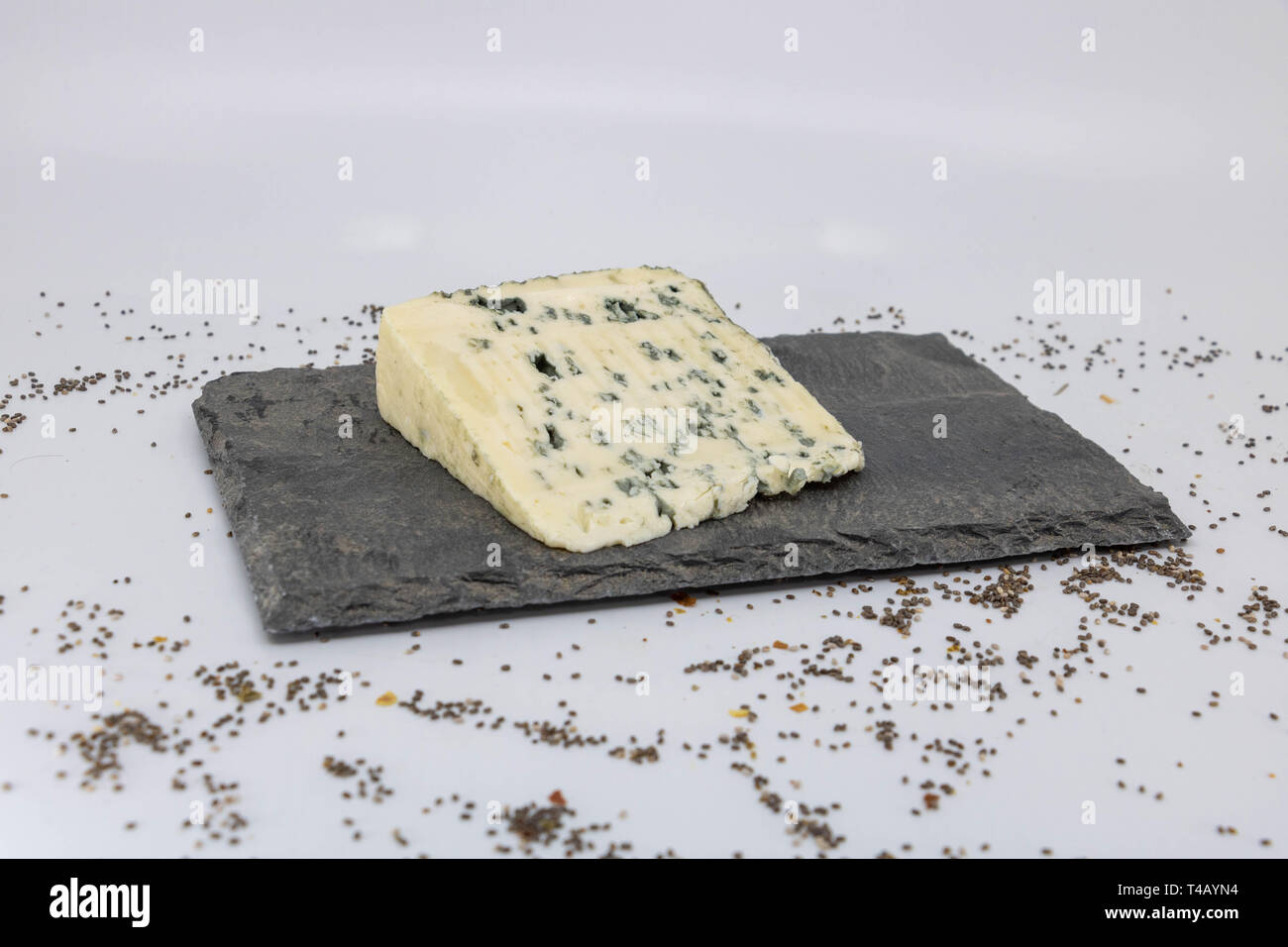 Slate cheese platter with a slice of Bleu (blue cheese with sheep's milk) Stock Photo