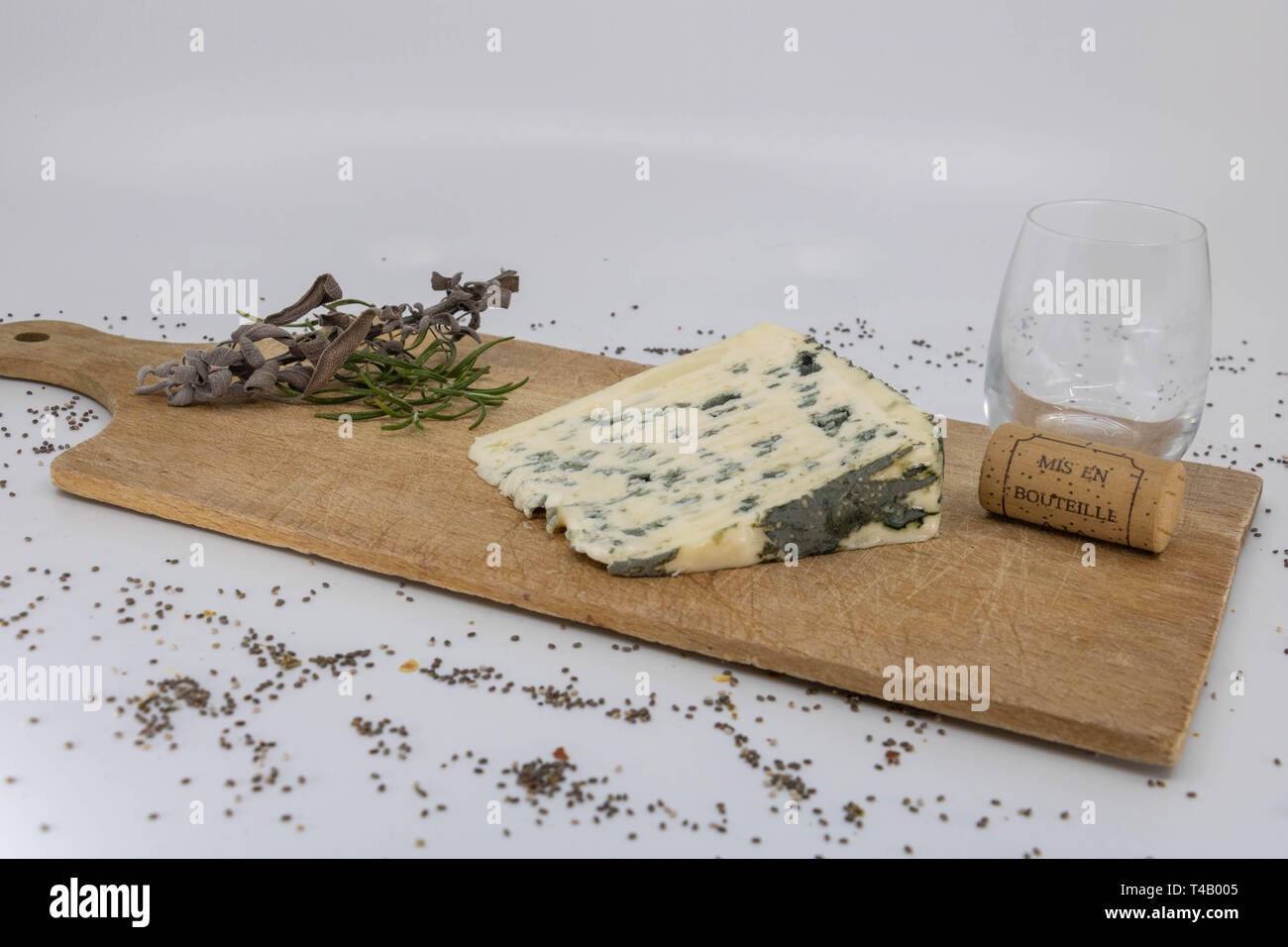 Tasting of sheep cheese with French wine and aromatic herbs Stock Photo