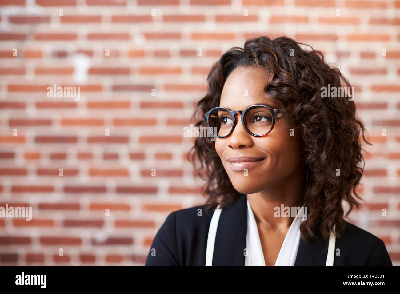 Woman wearing glasses in office hi-res stock photography and images - Alamy