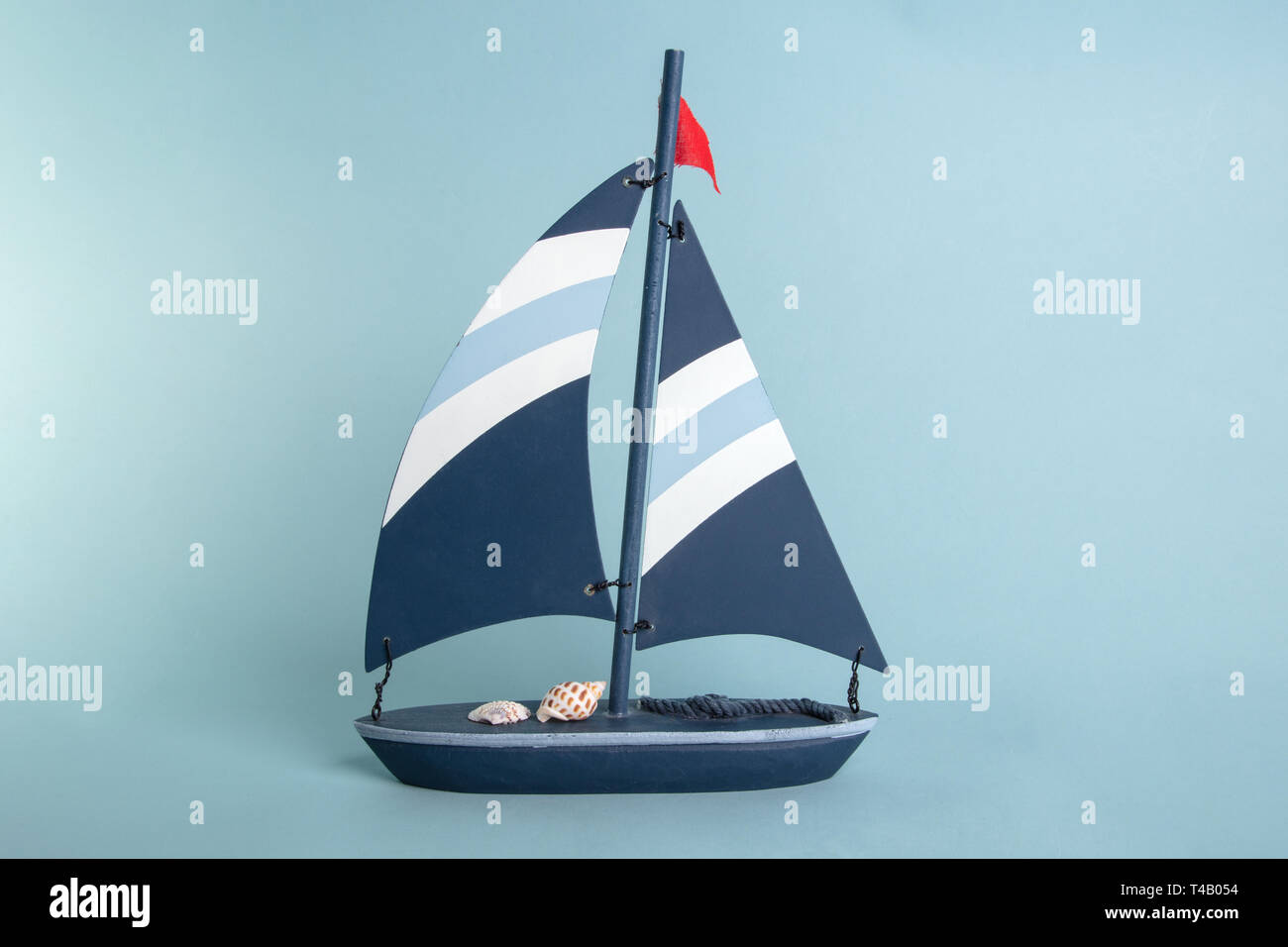 Wooden toy Boat on bright blue Background Stock Photo - Alamy