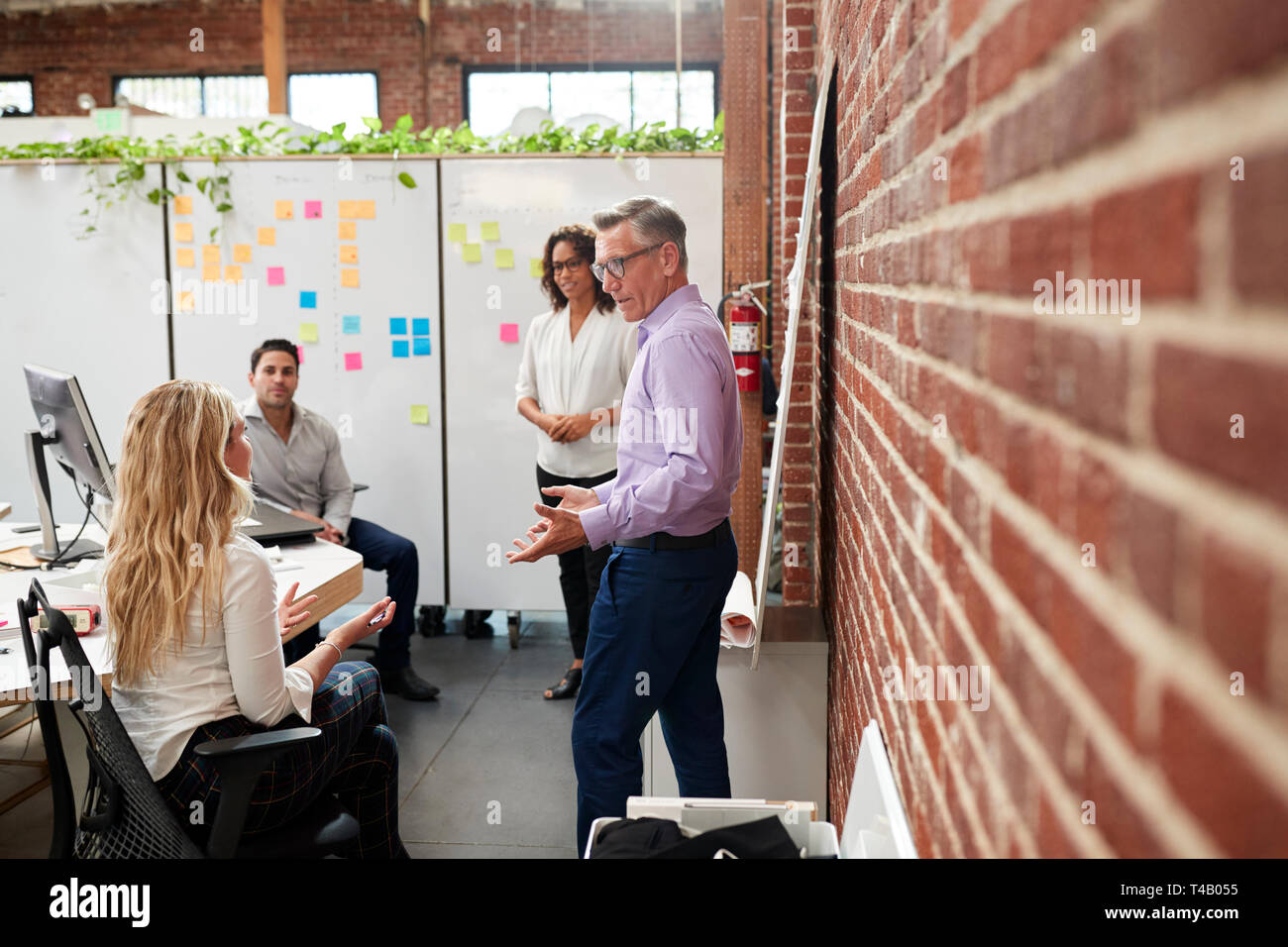 Creative Team Meeting To Discuss Ideas In Modern Office Stock Photo Alamy