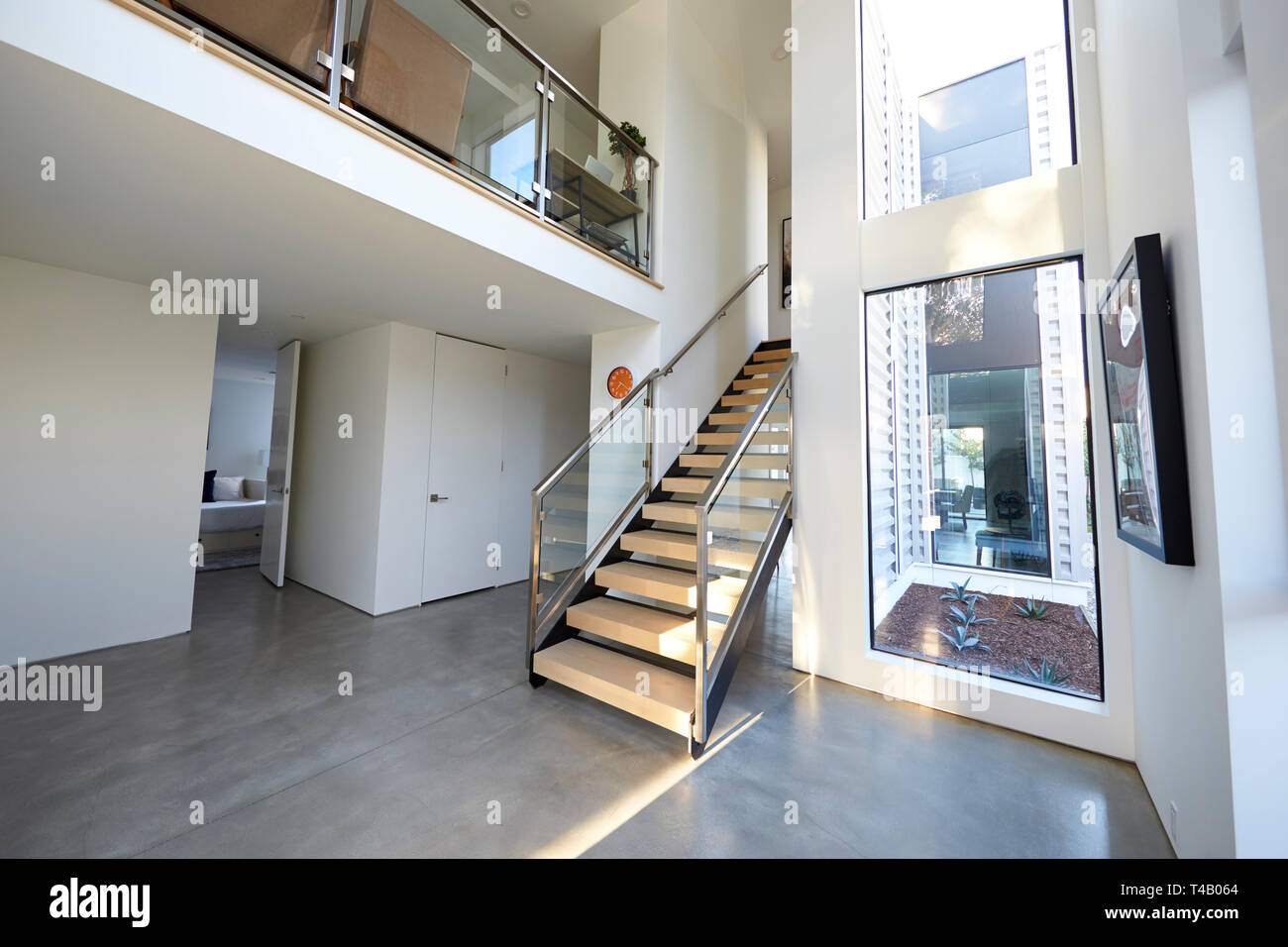 Staircase And Hallway In Stylish And Contemporary Empty Home Stock Photo
