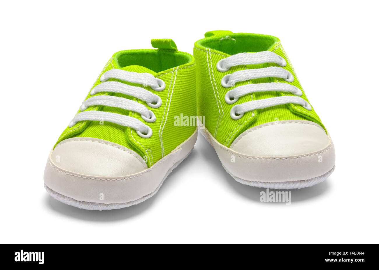 Pair of Green Baby Sneakers Isolated on White Background. Stock Photo