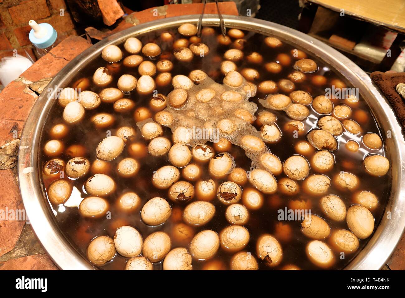 Taiwanese cuisine - eggs boiled in black tea. Jiufen Old Street market. Stock Photo
