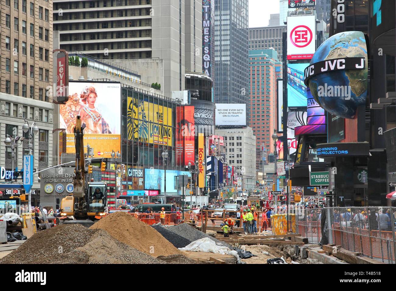 NEW YORK, USA - JULY 3, 2013: Workers perform construction works at Times Square in New York. The square at junction of Broadway and 7th Avenue has so Stock Photo