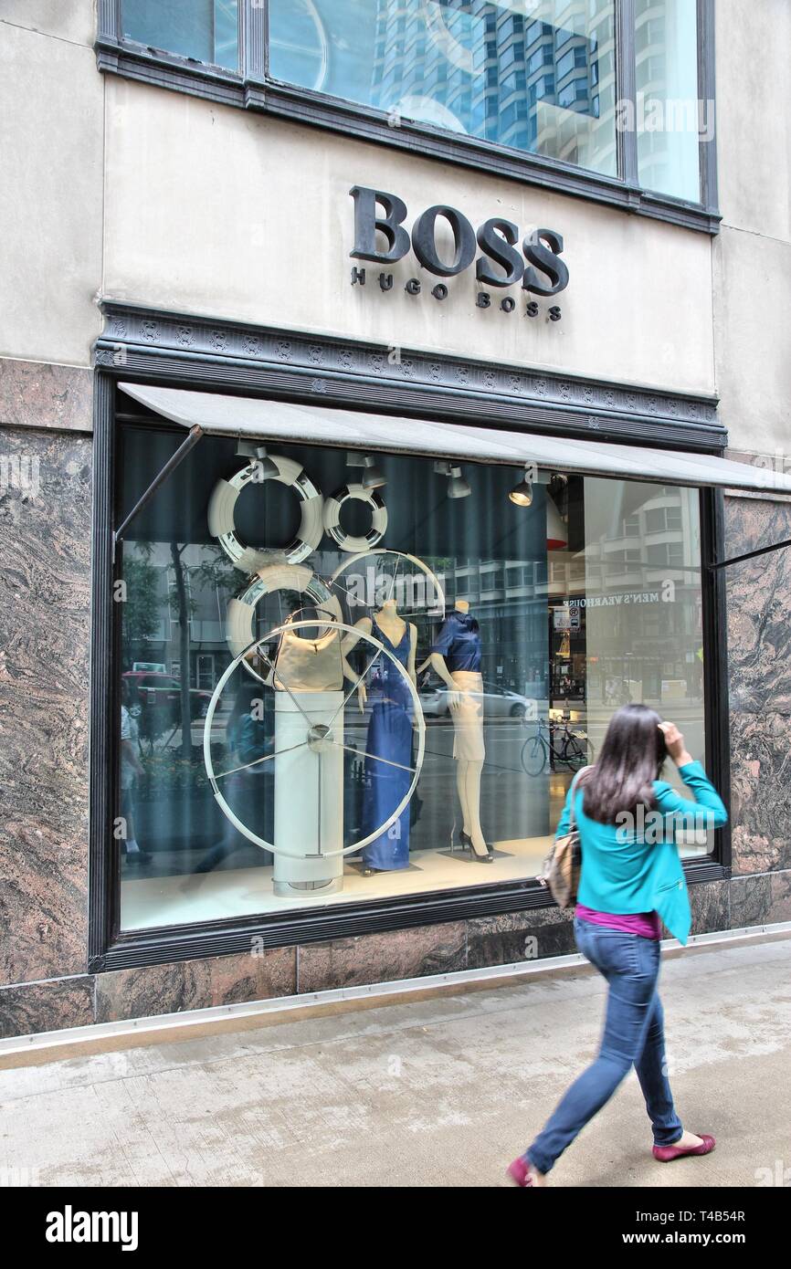 CHICAGO, USA - JUNE 26, 2013: Person walks by Hugo Boss store at  Magnificent Mile in Chicago. The Magnificent Mile is one of most  prestigious shopping Stock Photo - Alamy
