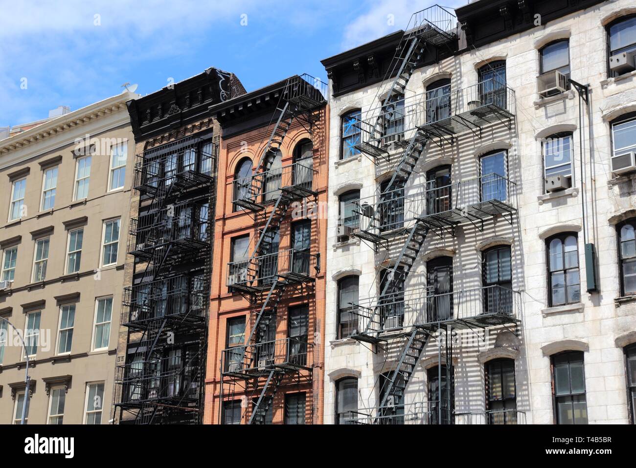 New York, USA - old residential buildings in Soho district. Fire escape stairs. Stock Photo