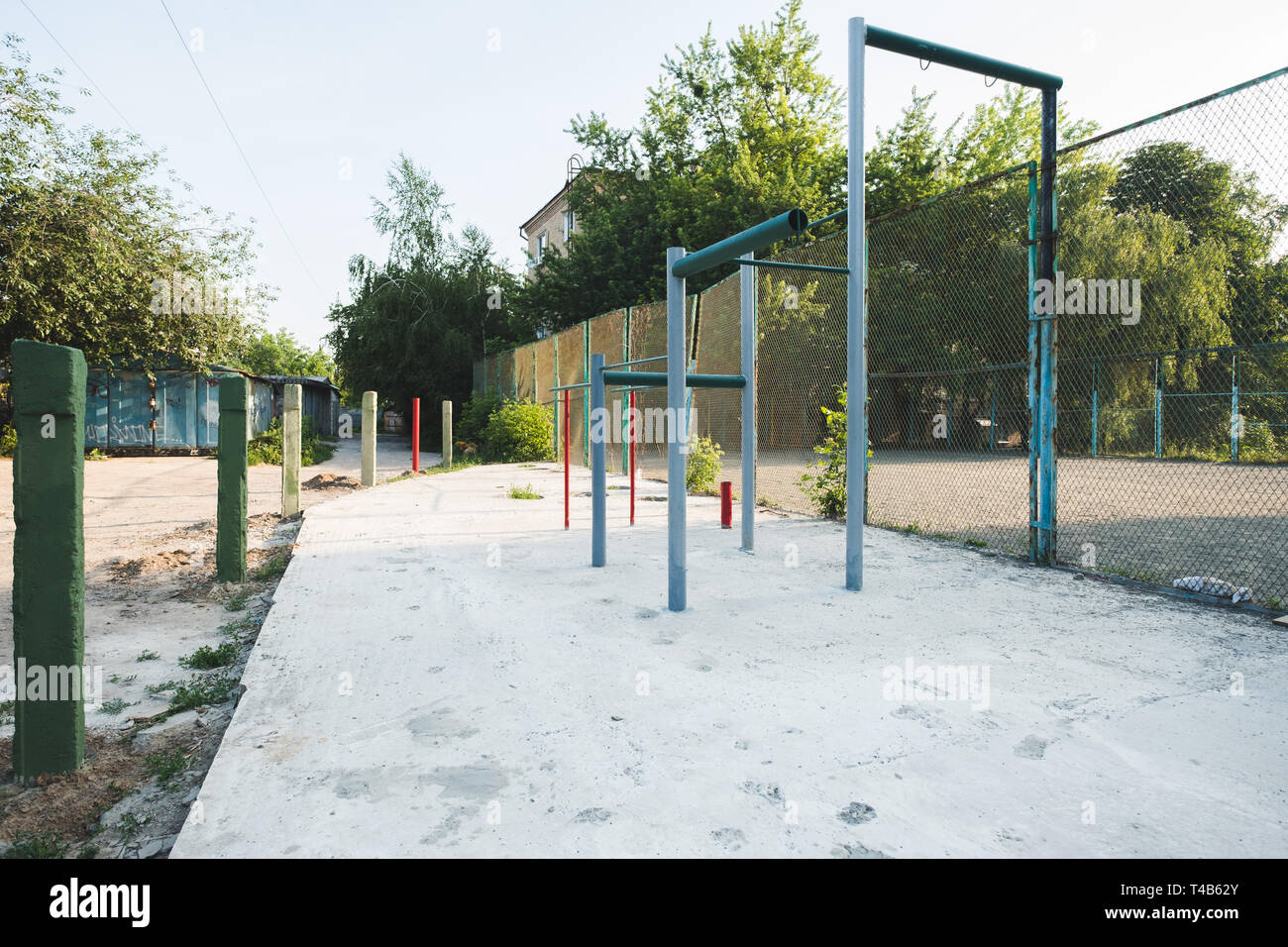 children's playground with swings in courtyard of residential building in the city, Kiev, Ukraine Stock Photo