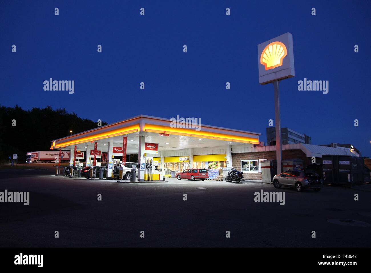 SANDEFJORD, NORWAY AUGUST 2, 2015 People fill their cars at Shell
