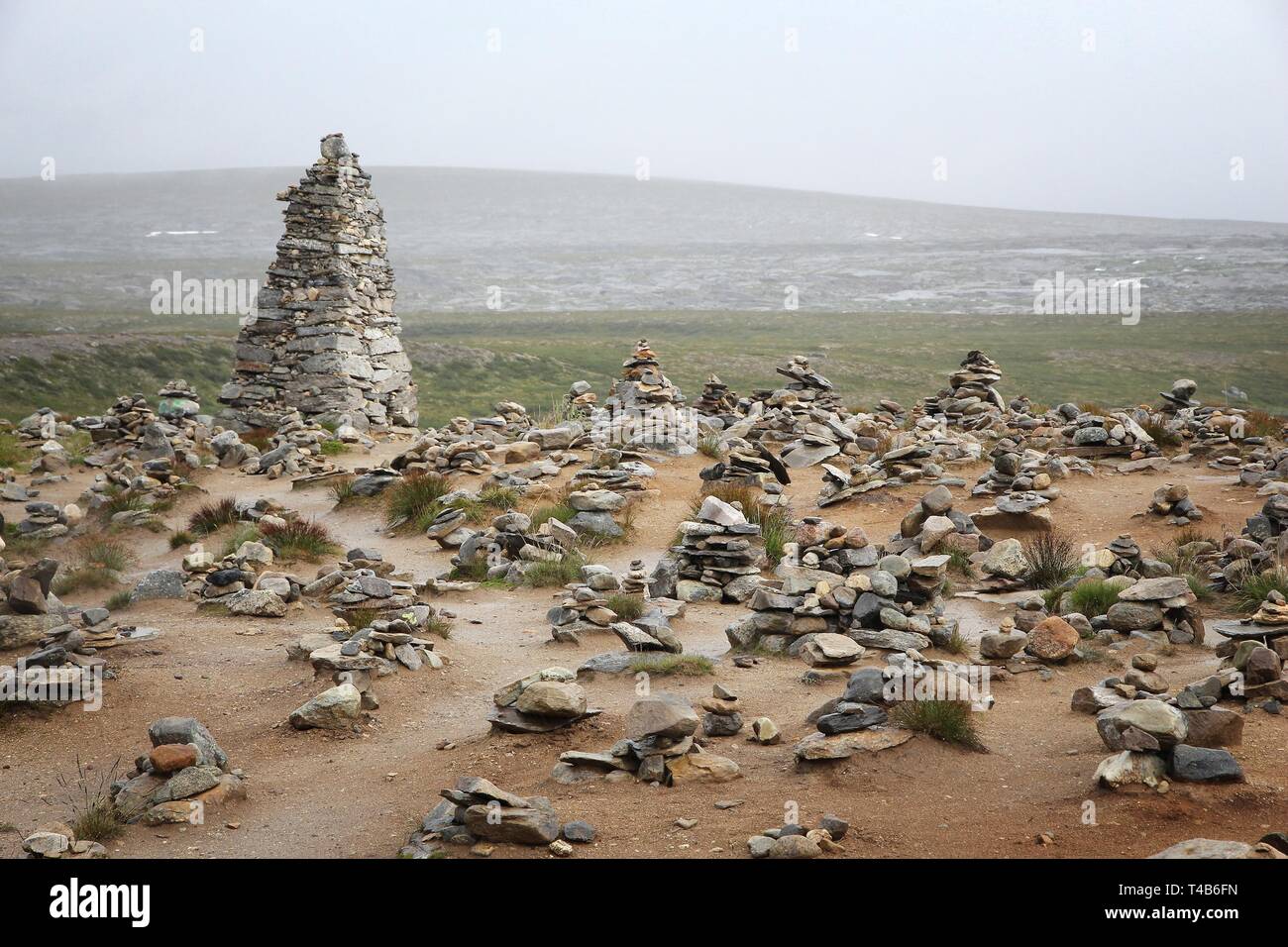 Arctic Circle in Norway - marked by tourists with stone cairns. Stock Photo