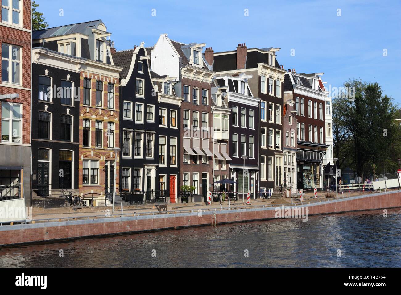 Amsterdam canal architecture - Prinsengracht canal rowhouses in De Wallen district. Stock Photo