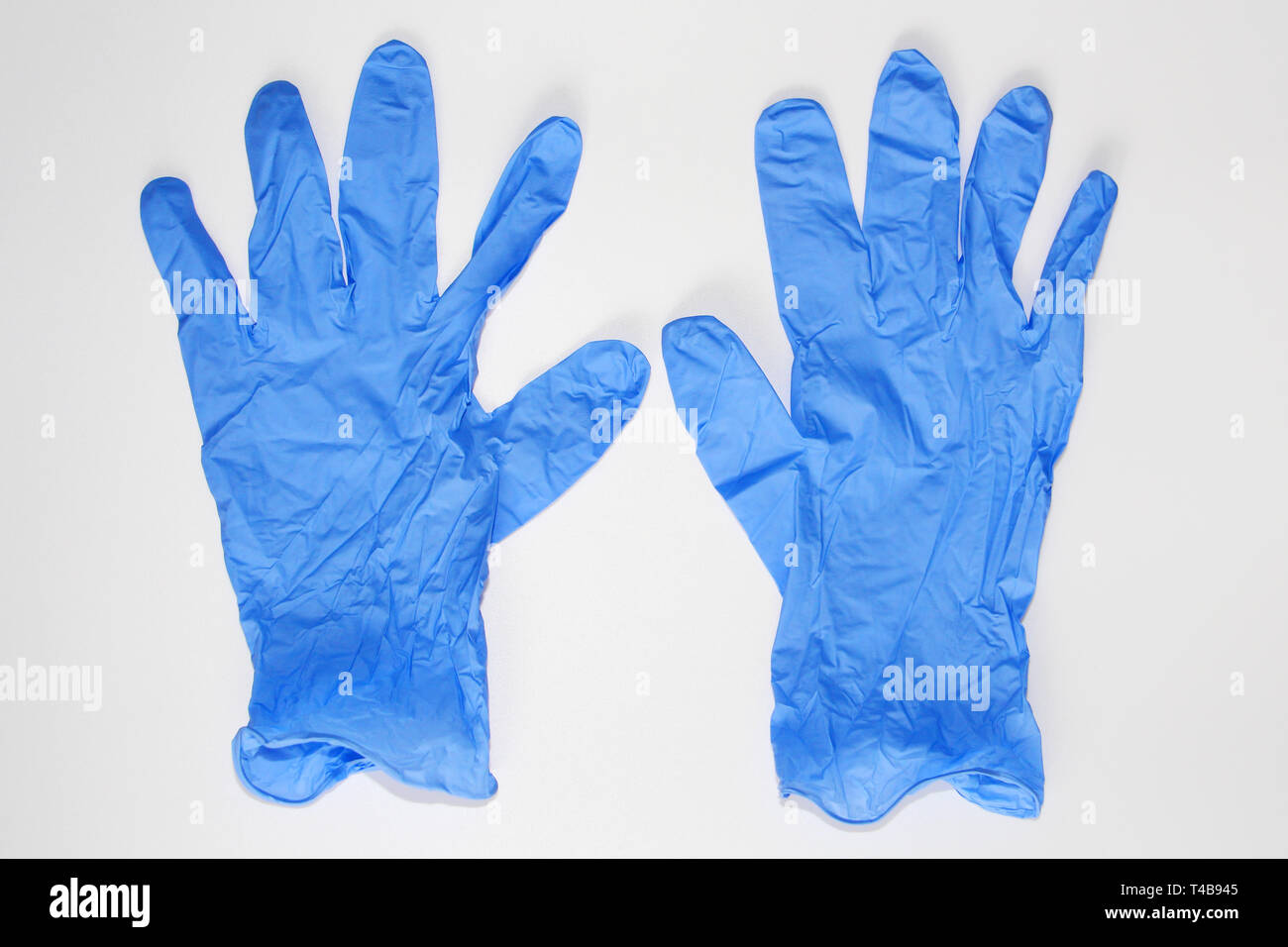 Blue medical gloves. Latex sterile gloves lie on a white background