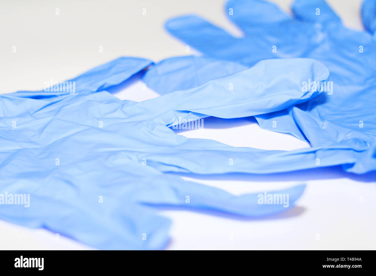 Blue medical gloves. Latex sterile gloves lie on a white background