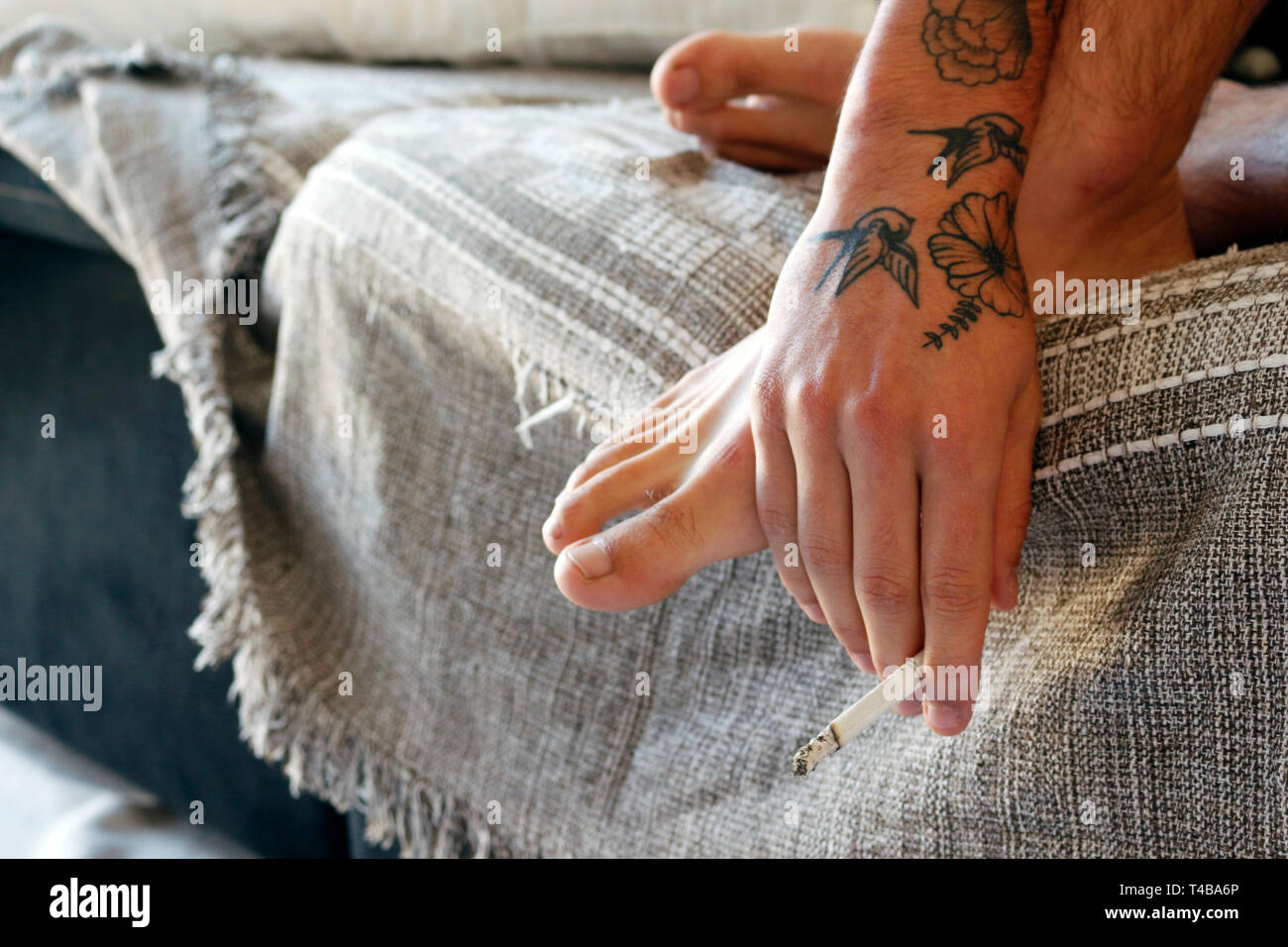 Feet On Couch High Resolution Stock Photography and Images - Alamy