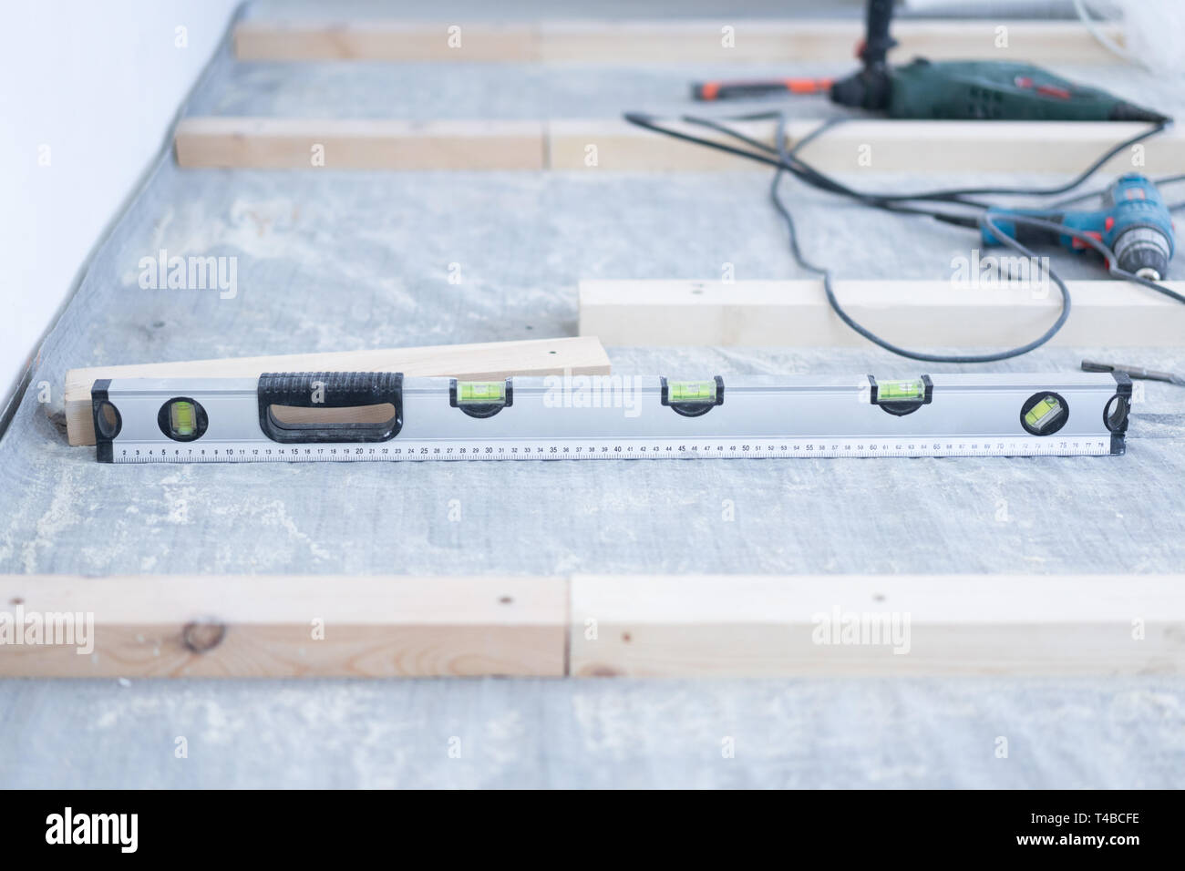 Laying Eco Friendly Wooden Flooring Installation Of A Log To