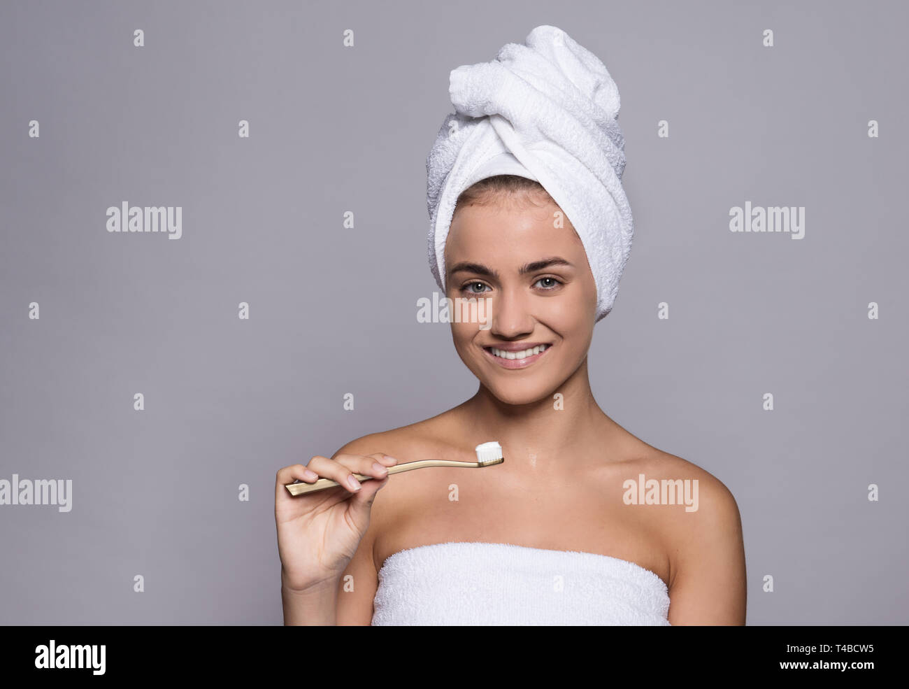 A portrait of a young woman with tootbrush in a studio, beauty and skin care. Stock Photo