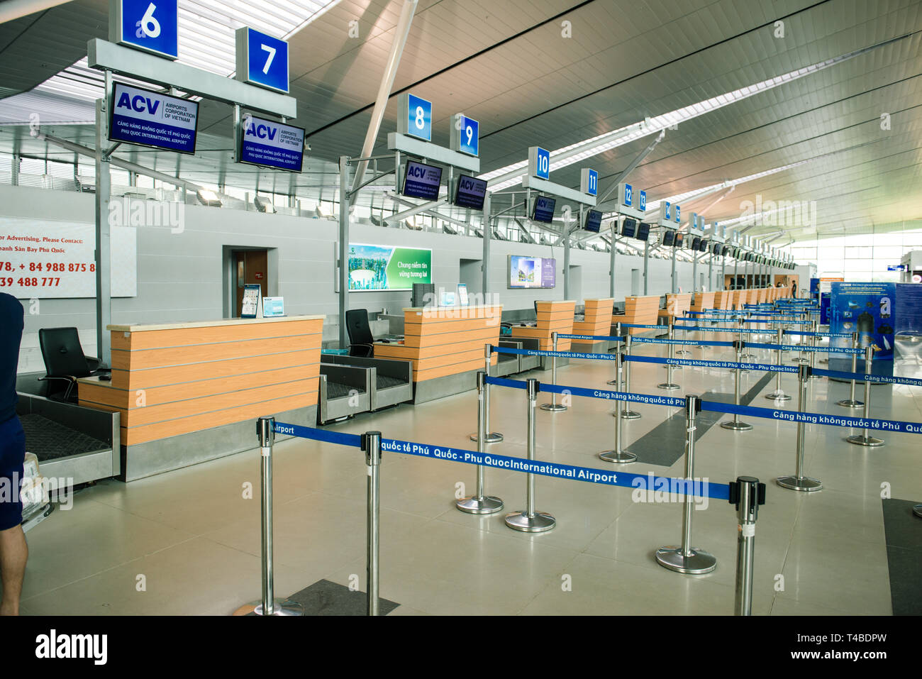 PHU QUOC, VIETNAM JUNE 28, 2017: The public check-in area of an airport with crowd control barriers Stock Photo
