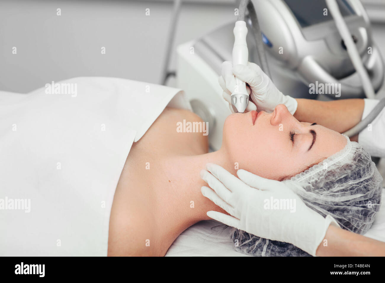 procedure renewing skin , no-needle high frequency mesotherapy.part of a series Stock Photo