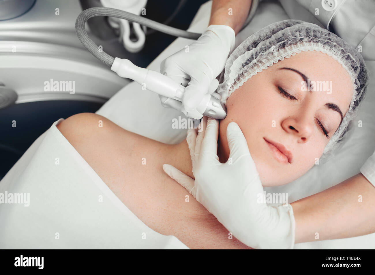 procedure renewing skin , no-needle high frequency mesotherapy.part of a series Stock Photo