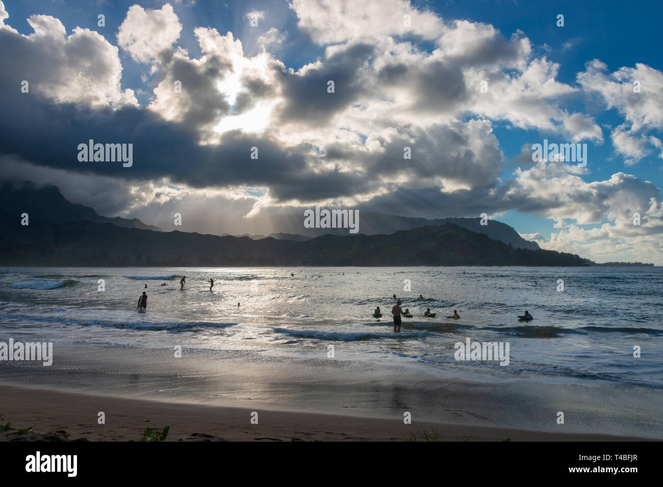Beach life on an afternoon at Waioli Beach Park, Hanalei Bay on the