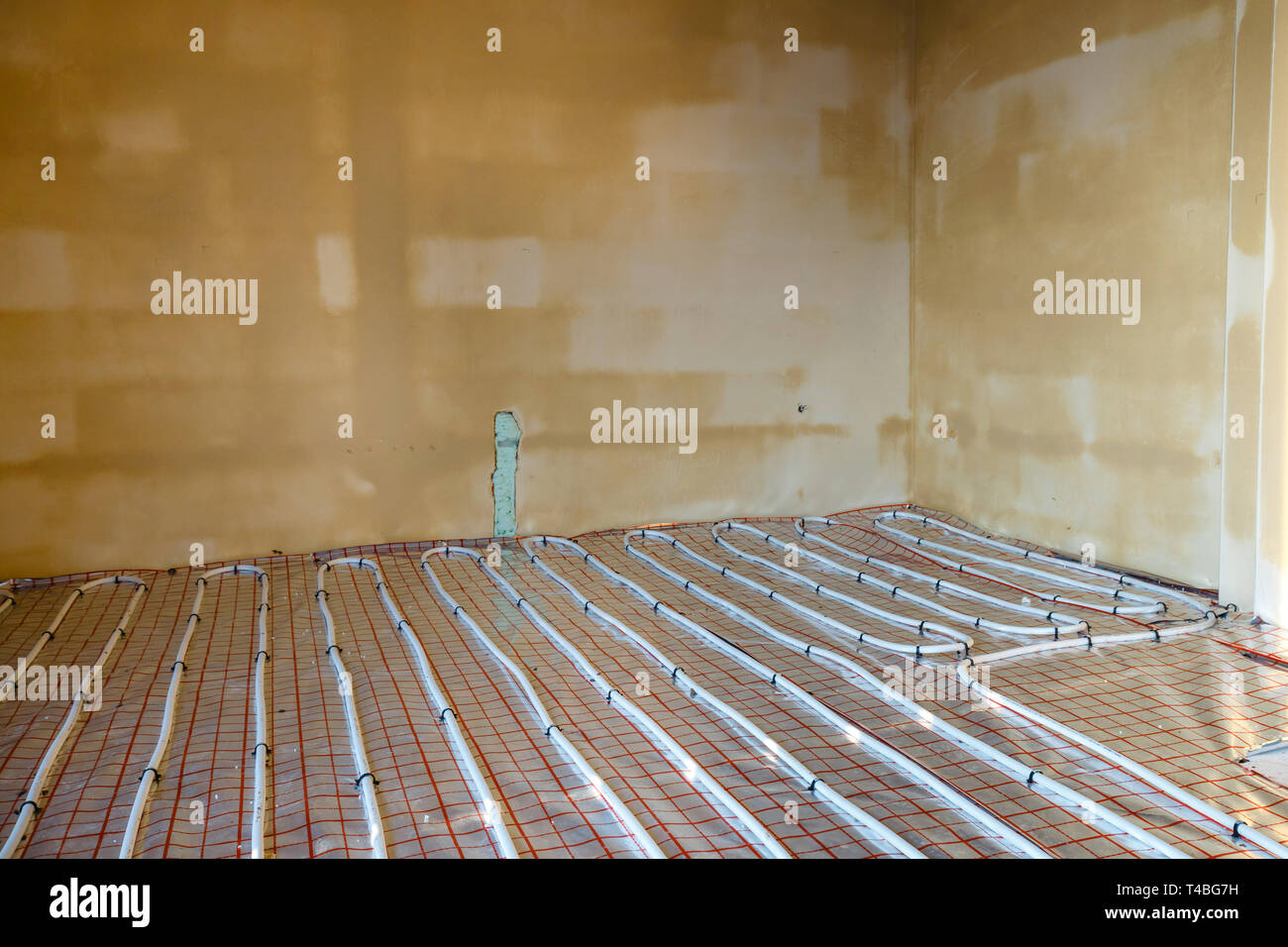 Close Up On Water Floor Heating System Interior Stock Photo