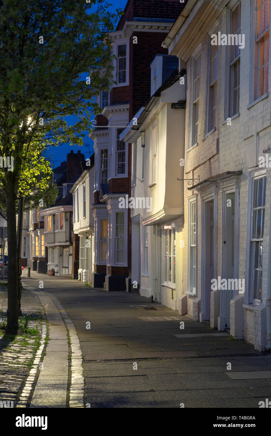 Picturesque Medieval houses in Abbey Street, Faversham, Kent, UK taken during the blue hour. Stock Photo