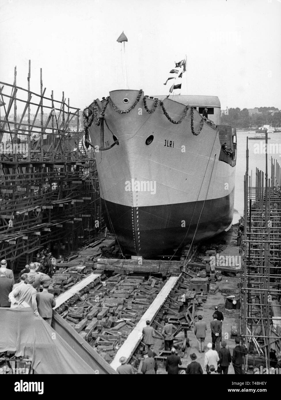 A 999 GRT heavy cargo ship is launched at the Neptun dockyard in Rostock, GDR, 26 July 1958. The ship with solidly welded hulk was bought by Hamburg-based shipowning company Basthold Richters and is the first on six build by Neptun. | usage worldwide Stock Photo