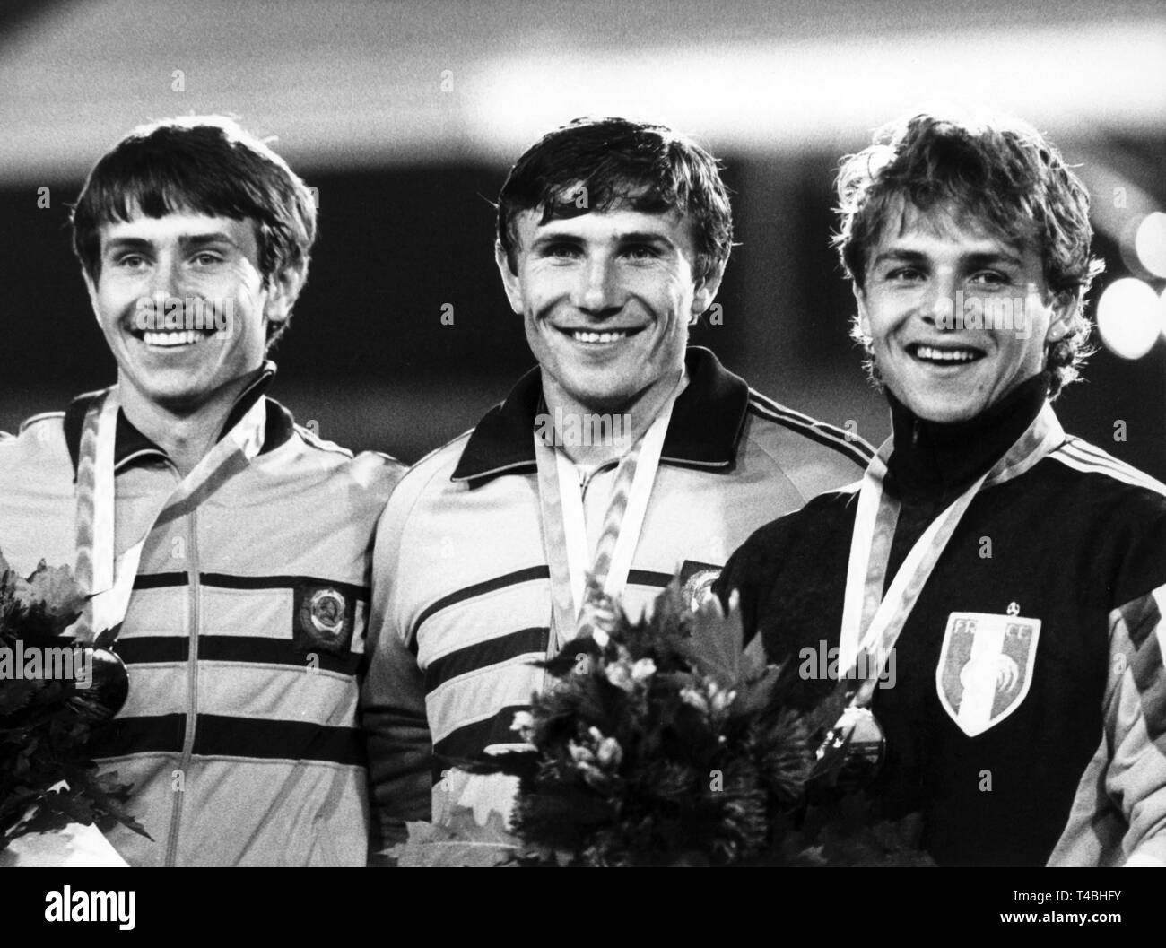 Brothers Sergej and Wassili Bubka from the Soviet Union celebrated a double win at pole vault on 29th August 1986. World record holder Sergej (m) won with 5,85m before his brother Wassili (l) with 5,75m and the Frenchman Philippe Collet (r). | usage worldwide Stock Photo